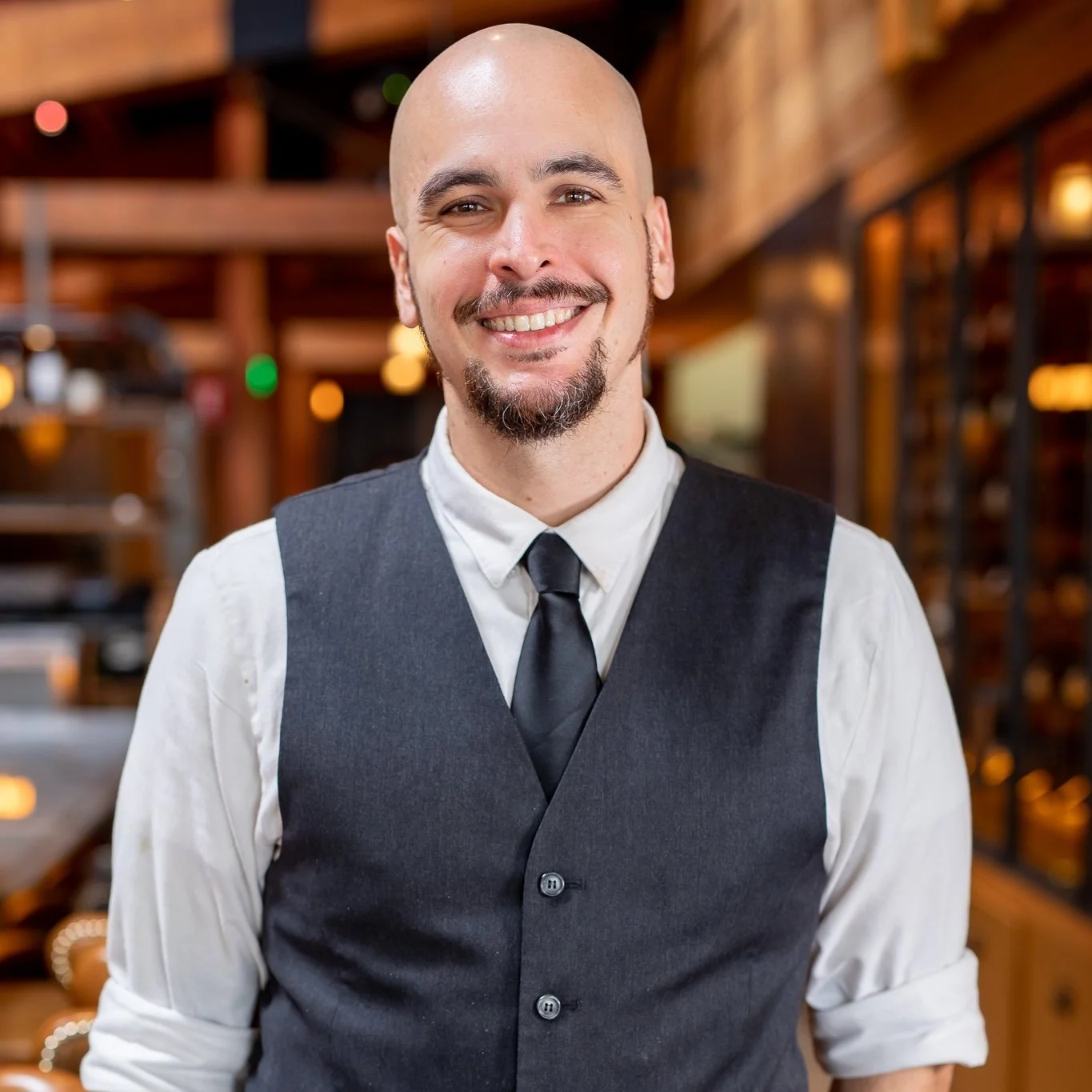 Michael is smiling in the restaurant