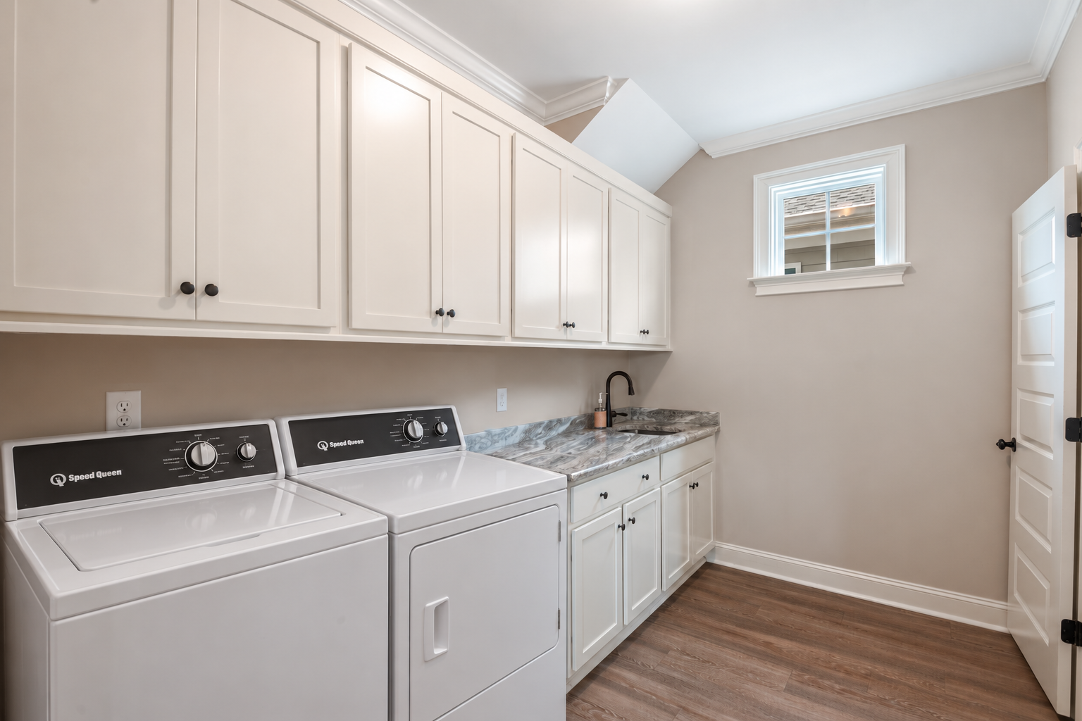 Bright Modern Laundry Room with Speed Queen Appliances.png