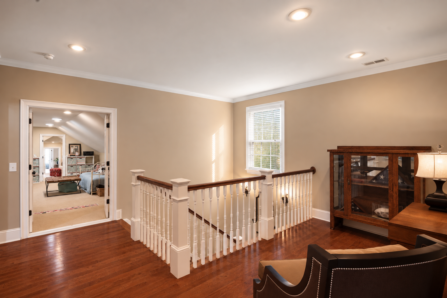 Warm Loft Landing with Staircase and Cabinet.png