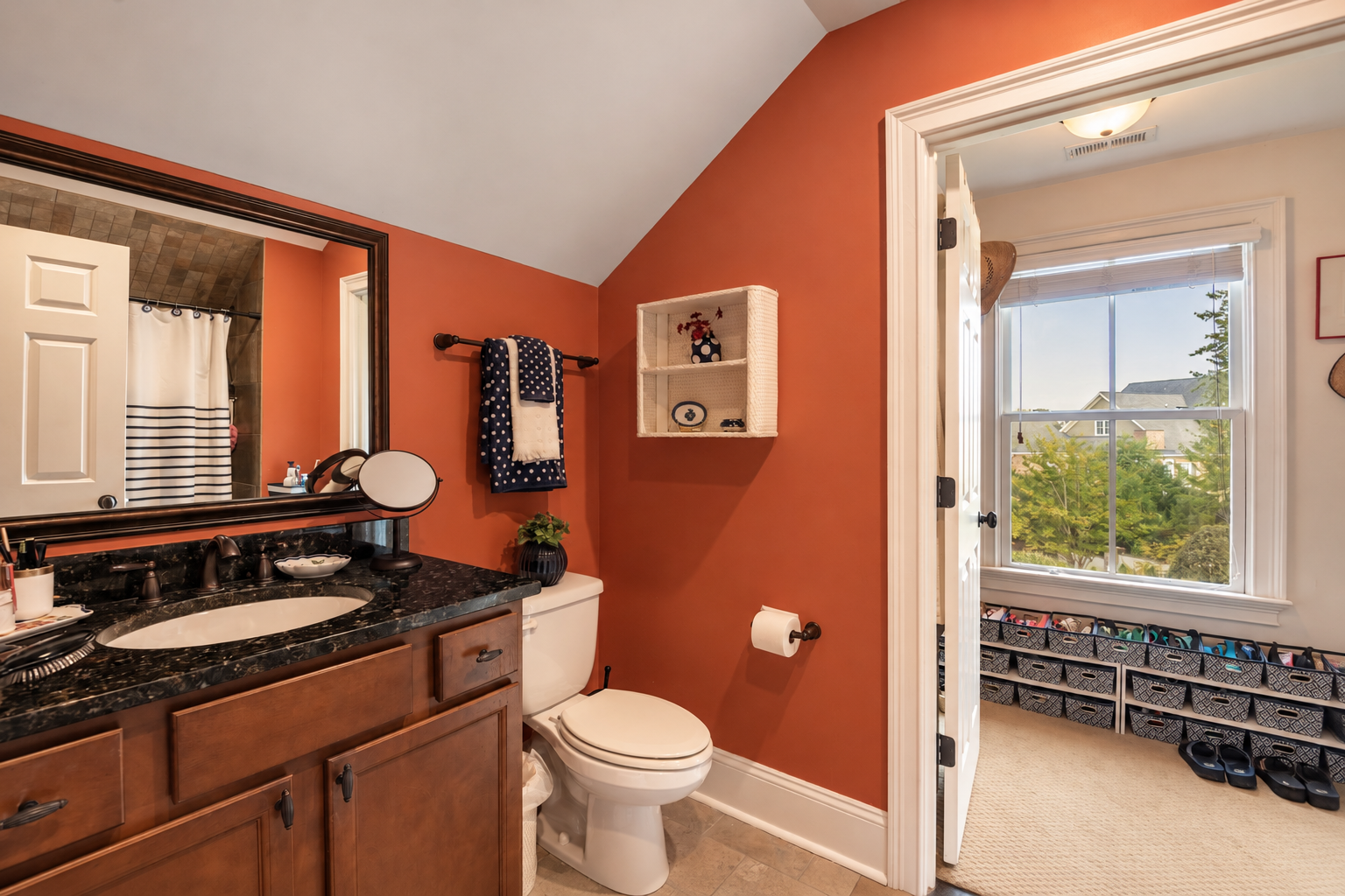 Warm Terracotta Bathroom with Sunlit Adjoining Room.png