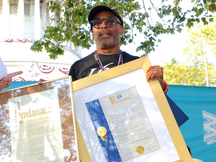 Spike Lee poses with proclamations. (Nadezda Tavodova Tezgor)