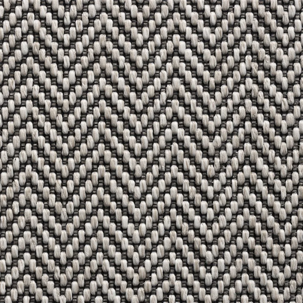 Herringbone stair runner with a taped border.