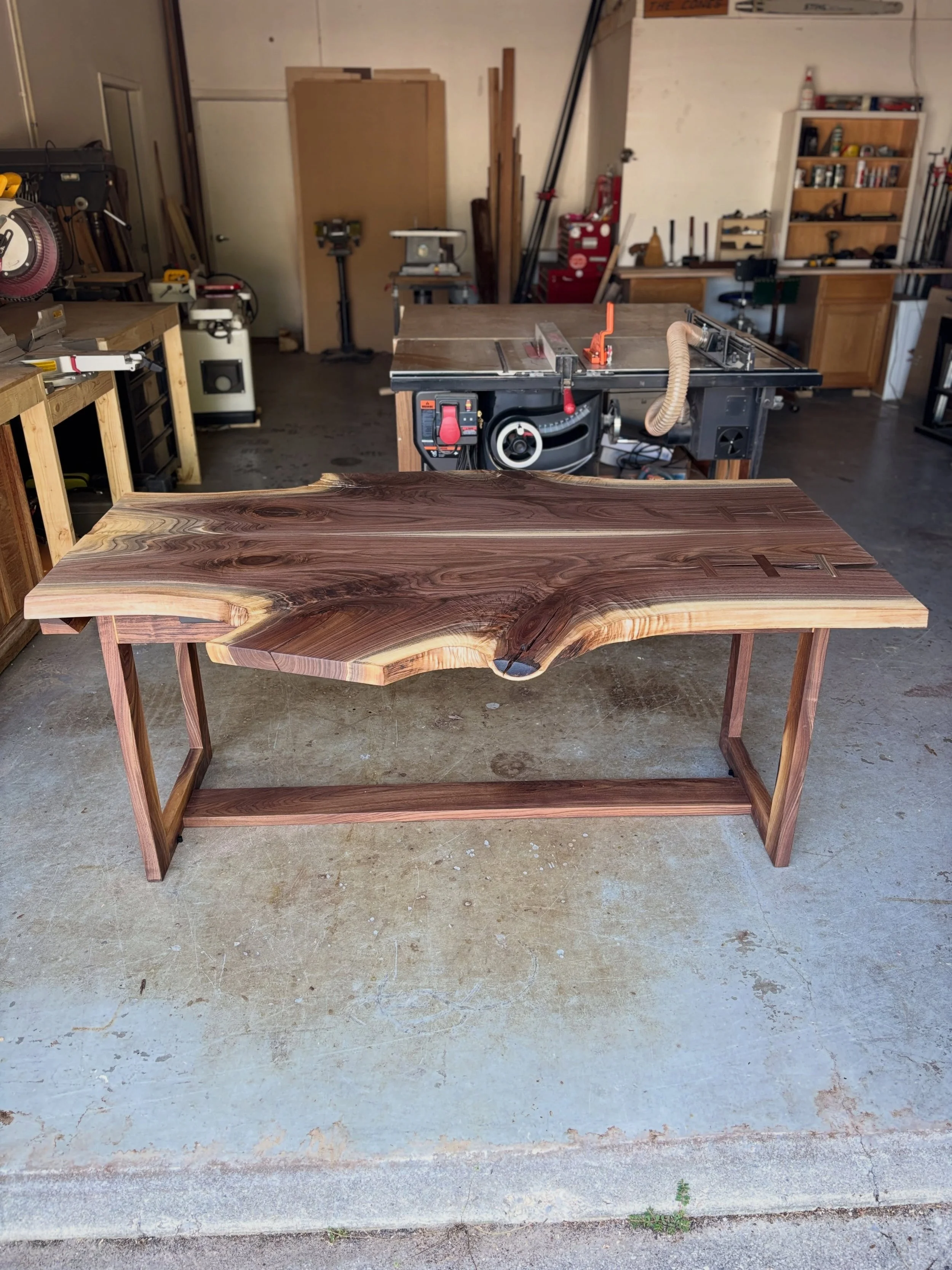 Walnut folding, wall-hanging table. This features bookmatched walnut slabs, inlays, folding legs, and a french cleat to mount this beast on the wall when it&rsquo;s not in use. 

| #conefurnishings #walnut #foldingtable #customfurniture