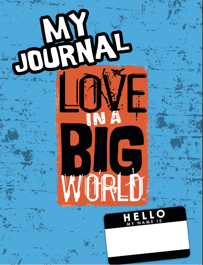 Colorful book cover with the title "My Journal: Love in a Big World" in bold letters, a black and white name tag at the bottom saying "Hello, My Name Is," on a textured blue background.