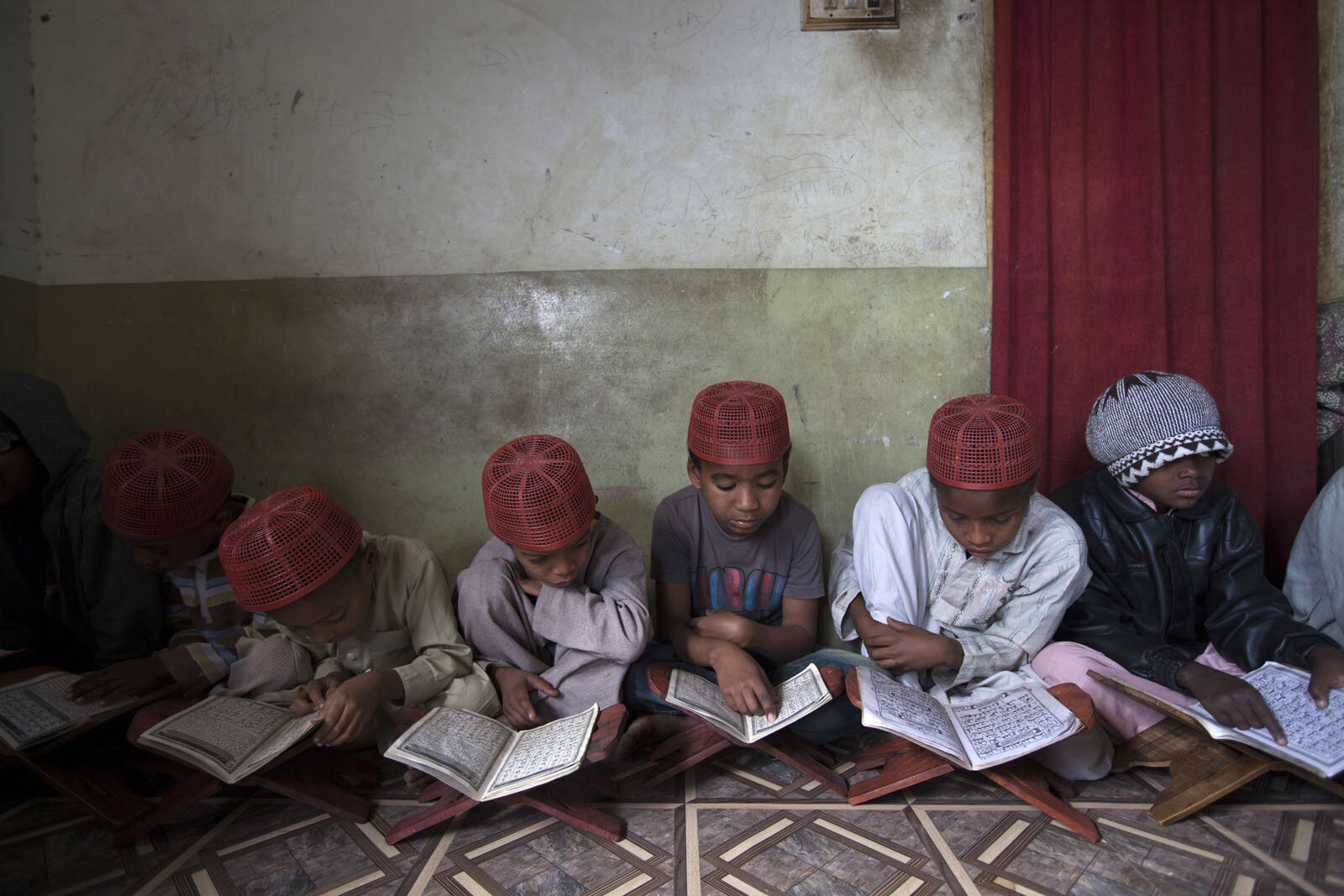 Sheedi boys learn from the Quran in a small madrassa in a rundown suburb of Hyderabad.