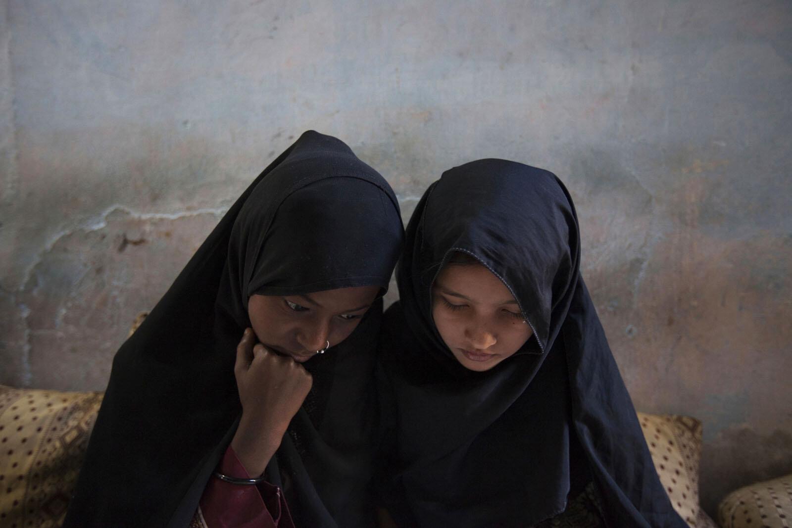 Two Sheedi girls study in an after school class in a suburb of Karachi.