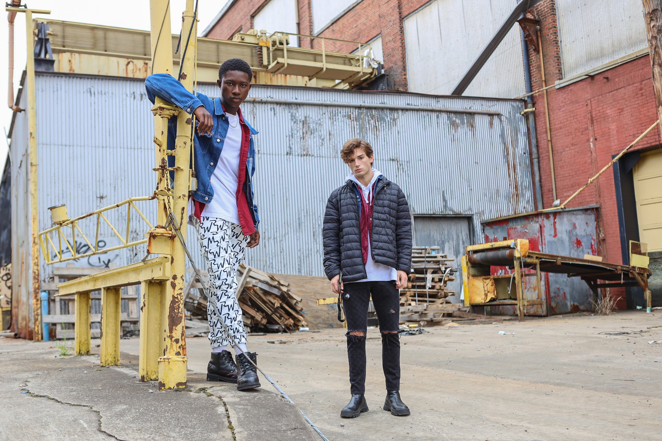 Two Male Model posing in warehouse setting for an editorial