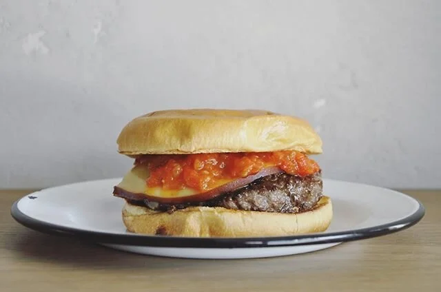 BTS look of version 0.9.1 - a beta version if you will- of our burger 🍔: beef patty, smoked gouda, piperade on a brioche bun. Chef Jose battled the eternal conflict of bun selection in the iterative development of this masterpiece. The version photo