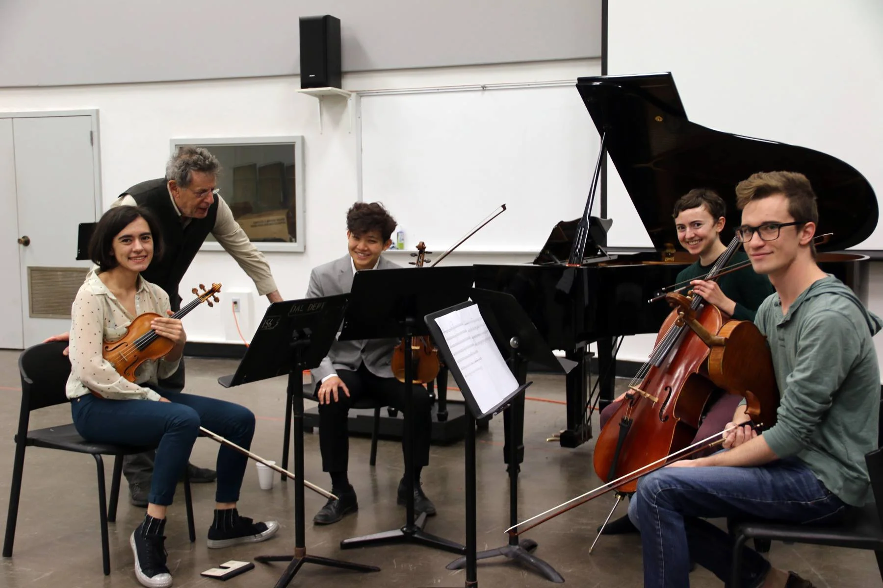 2018 Composer-in-Residence Philip Glass coaching young artists.