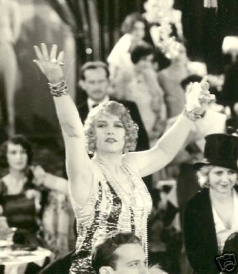 Evoking forbidden liquors, fur and feathers of the showgirls' outfits, smoke flowing in the air…