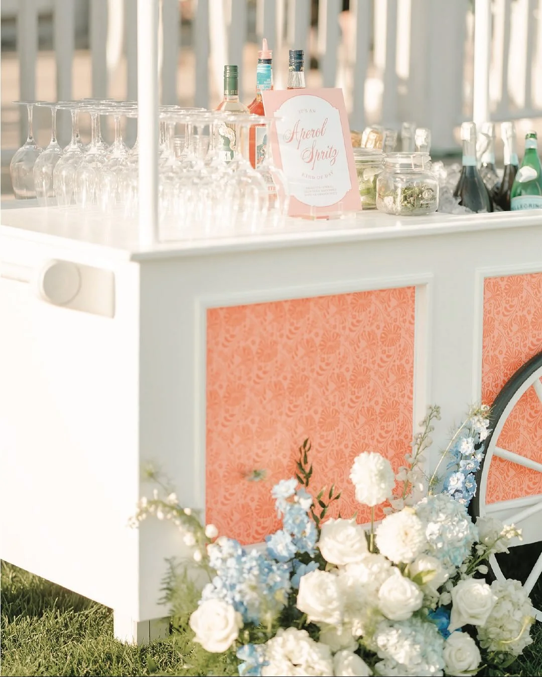 Two grooms, one gorgeous beach backdrop, and a whole lot of fun.

This Dunes Club wedding was classic New England charm with just the right amount of whimsy &mdash; lush woven textures, fern‑filled ceilings, layered patterns, and a bright seaside pal