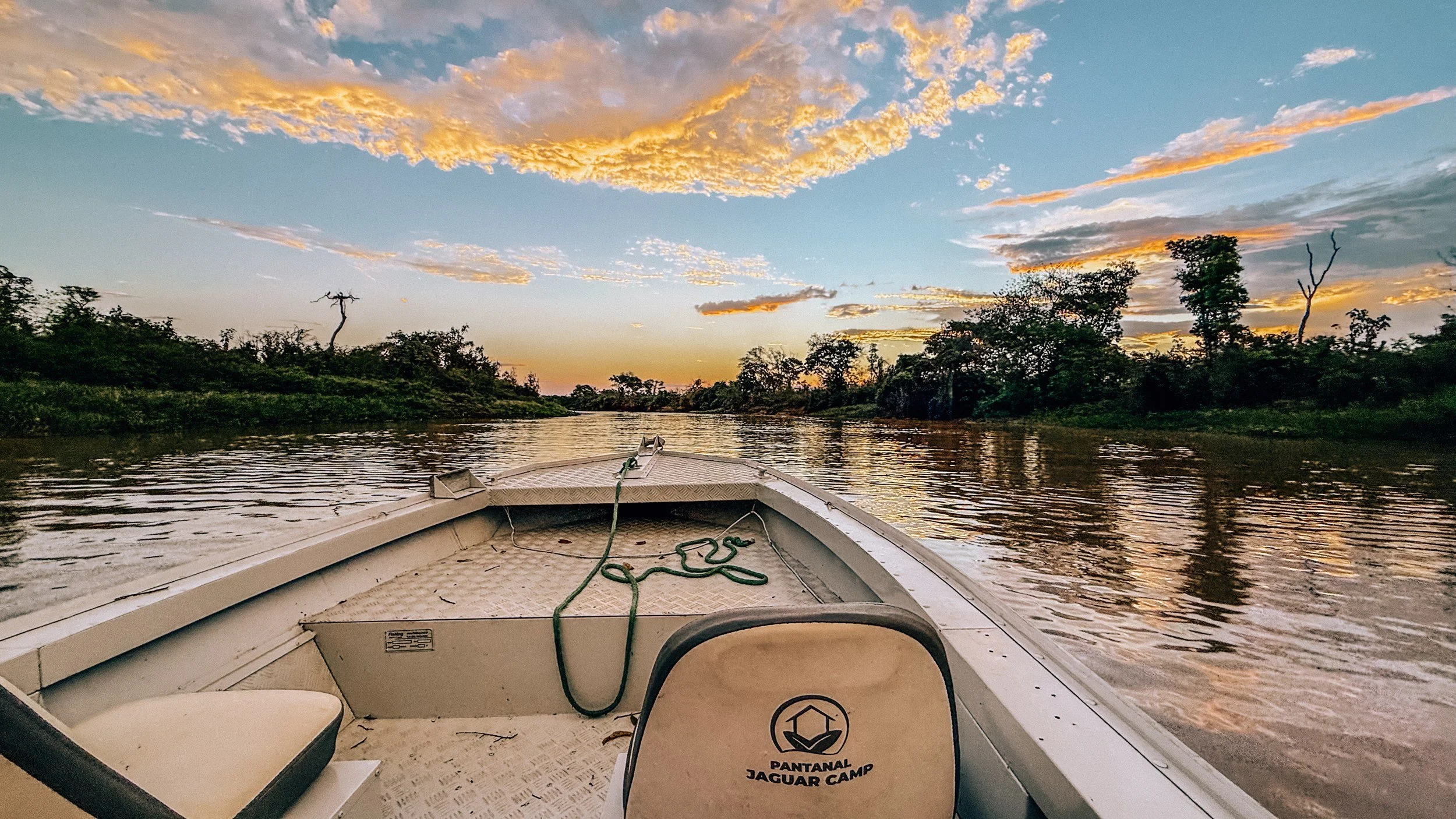 Sunset over a river in the Pantanal from the bow of a Pantanal Jaguar Camp boat