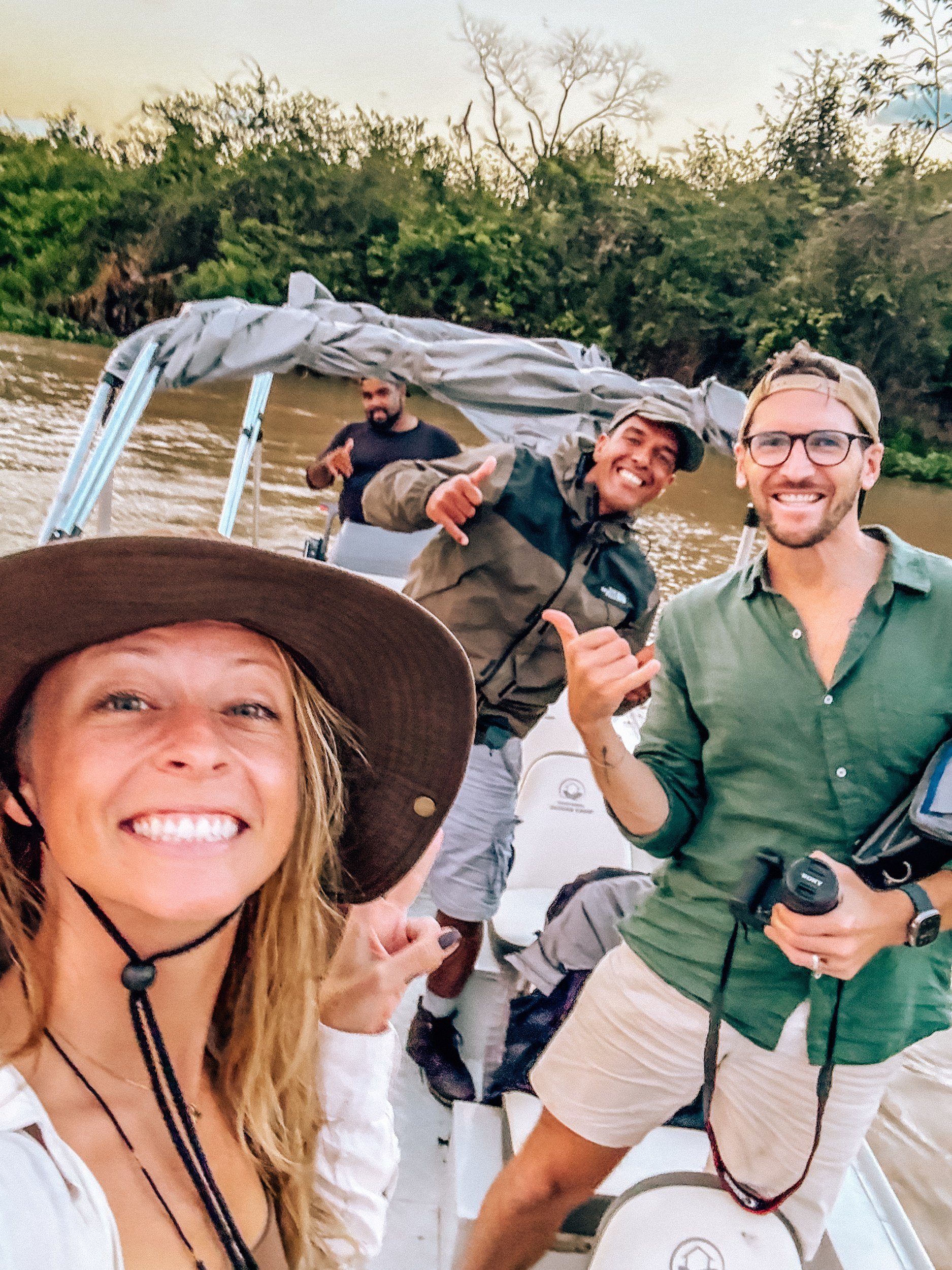 Kellie Paxian with guides on a boat safari at Pantanal Jaguar Camp