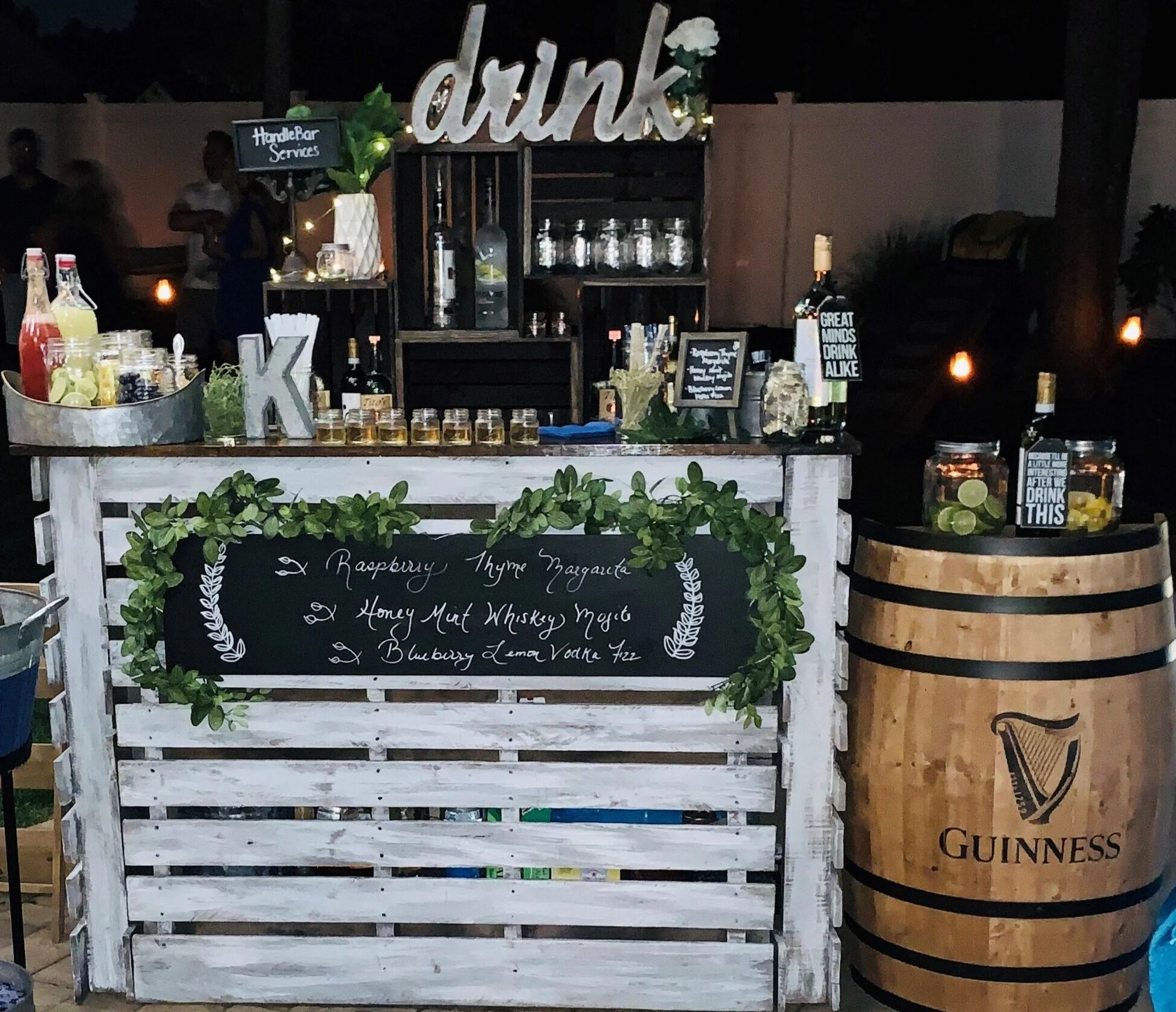 Rustic portable bar and beer station with galvanized tubs and whiskey barrel kegerator by HandleBar Services.