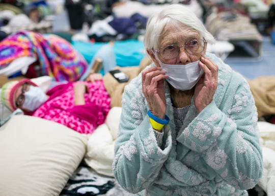 85-year-old Minna Anderson, right, sits on a bed next to her daughter Libby Andersen, left, at the East Avenue Church Shelter in Chico, California, on Nov. 15, 2018. The two lost everything when the Camp Fire took over their home in Paradise, forcing them to flee. (Photo: Thomas Hawthorne/USA TODAY NETWORK)