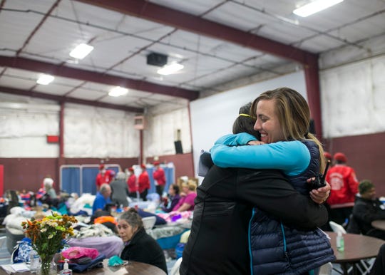 ER nurse Birgitte Randall, right, hugs a volunteer at the East Avenue Church Shelter in Chico, California, on Nov. 17, 2018. Randall fled her burning hospital Feather River in Paradise as the Camp Fire raged through town, eventually destroying her home. Responding to a Facebook request for help at the East Avenue Shelter, Randall and several of her colleagues and friends quickly sprung to action, starting a pop-up clinic at the shelter to aid evacuees in need of medical attention. (Photo: Thomas Hawthorne/USA TODAY NETWORK)