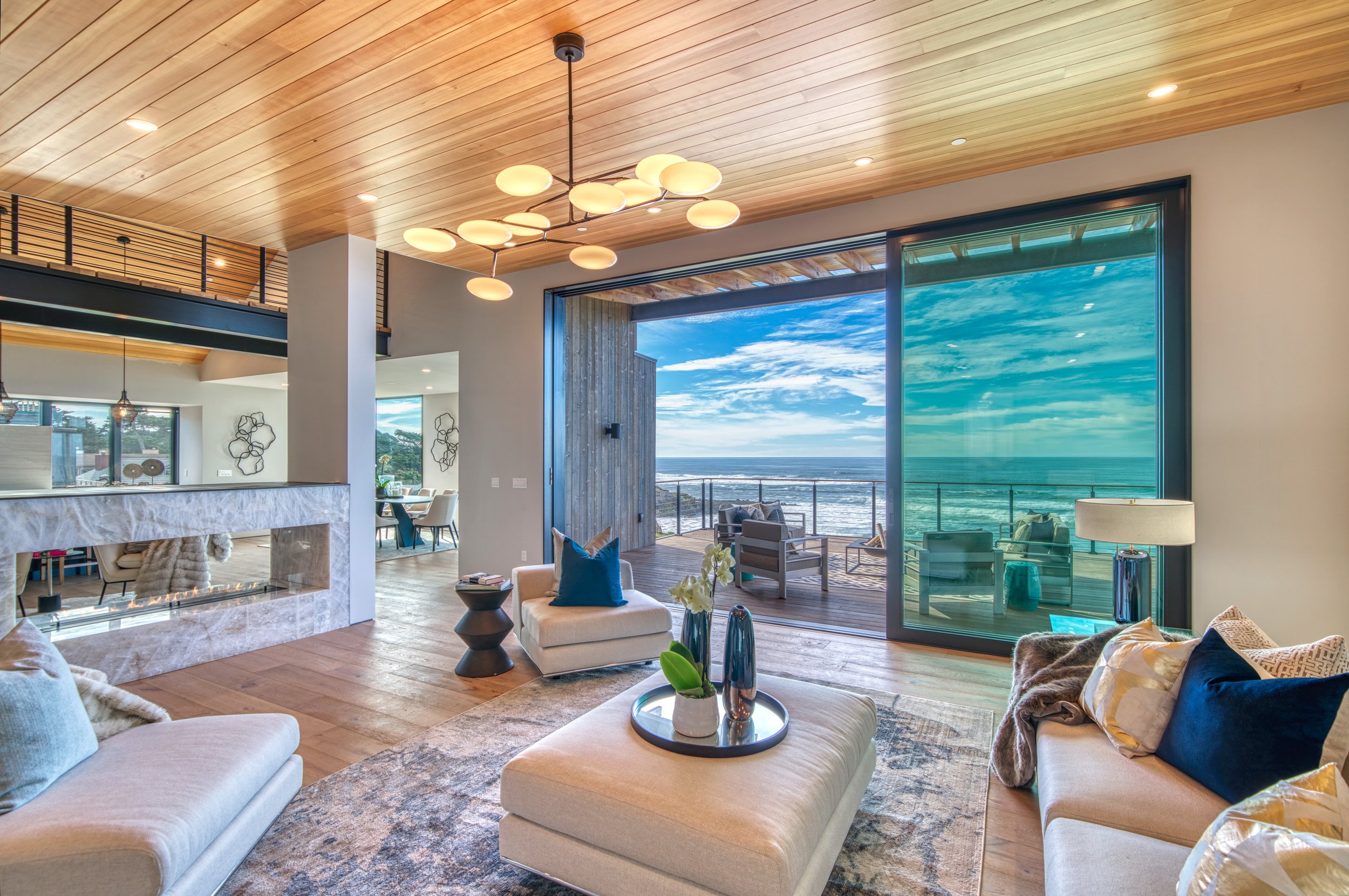6b-living-room-Bianco-quartzite-fireplace-slab-ocean-view-deck.jpg