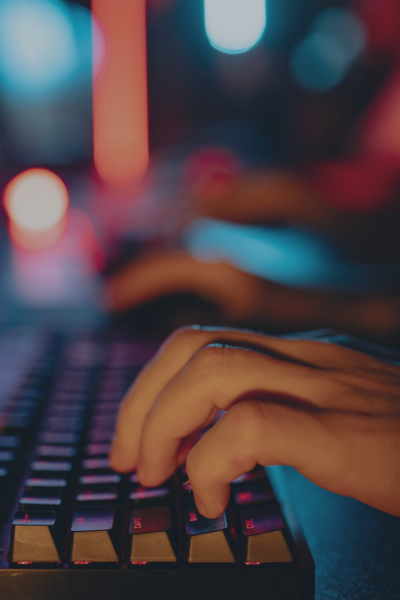 Hands typing on a keyboard representing cyberattacks and digital warfare linked to U.S., Israel, and Iran cyber conflict.
