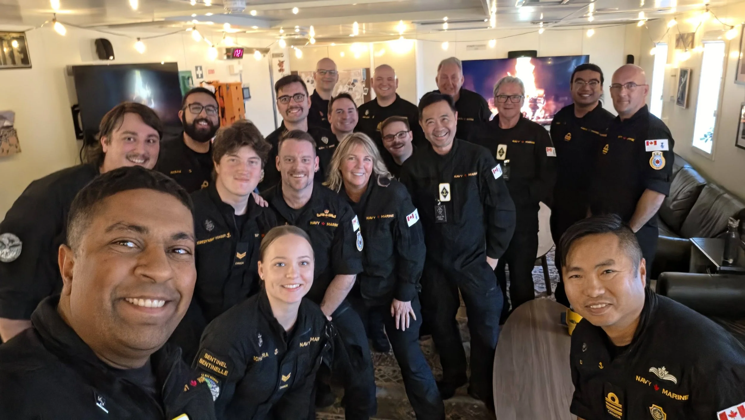 Ammolite Security CEO Cara Wolf with Canadian Leaders at Sea participants and Royal Canadian Navy personnel aboard HMCS Max Bernays.
