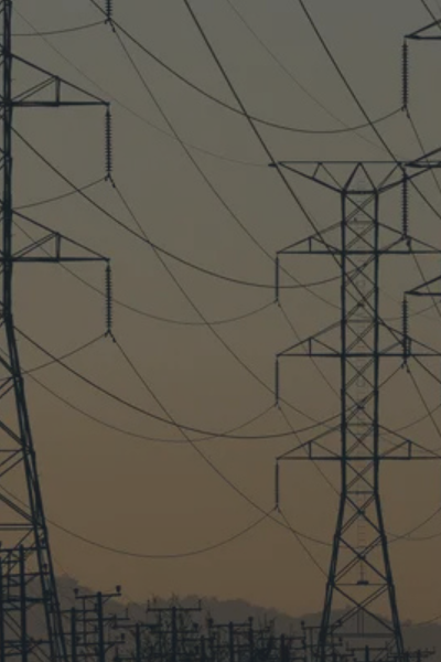 Power transmission lines and electrical infrastructure representing critical infrastructure protection, energy sector cybersecurity, and resilience planning against large-scale cyber threats and attacks.