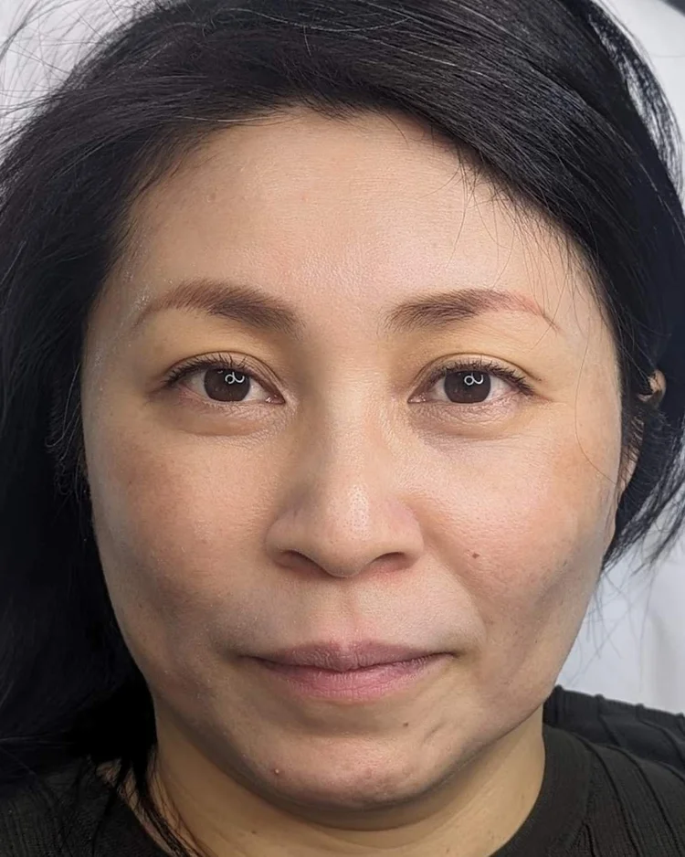 Before hybrid brow treatment — mis-shaped eyebrows on tan skin tone — Le Kitsuné NYC