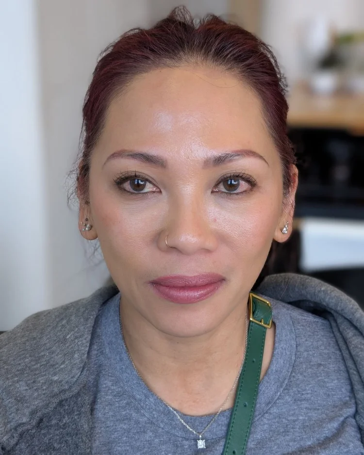 Very sparse thin eyebrows before hybrid brow treatment on medium skin tone — Le Kitsuné NYC