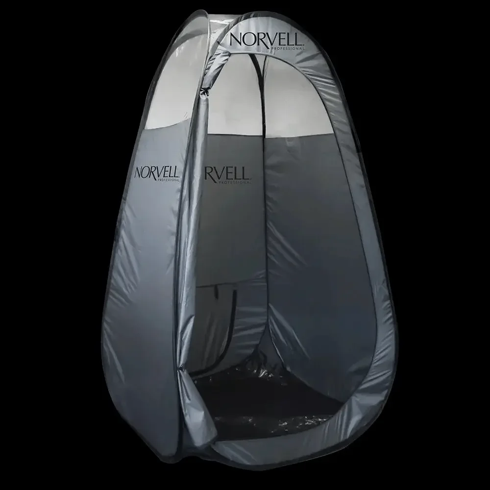 inside spray pop up tan booth at dkpESTHETICS