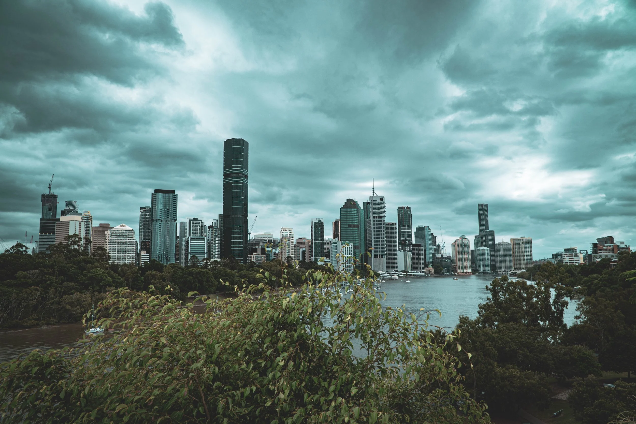 AEGIS Market volatility in 2023, Brisbane skyline with grey clouds