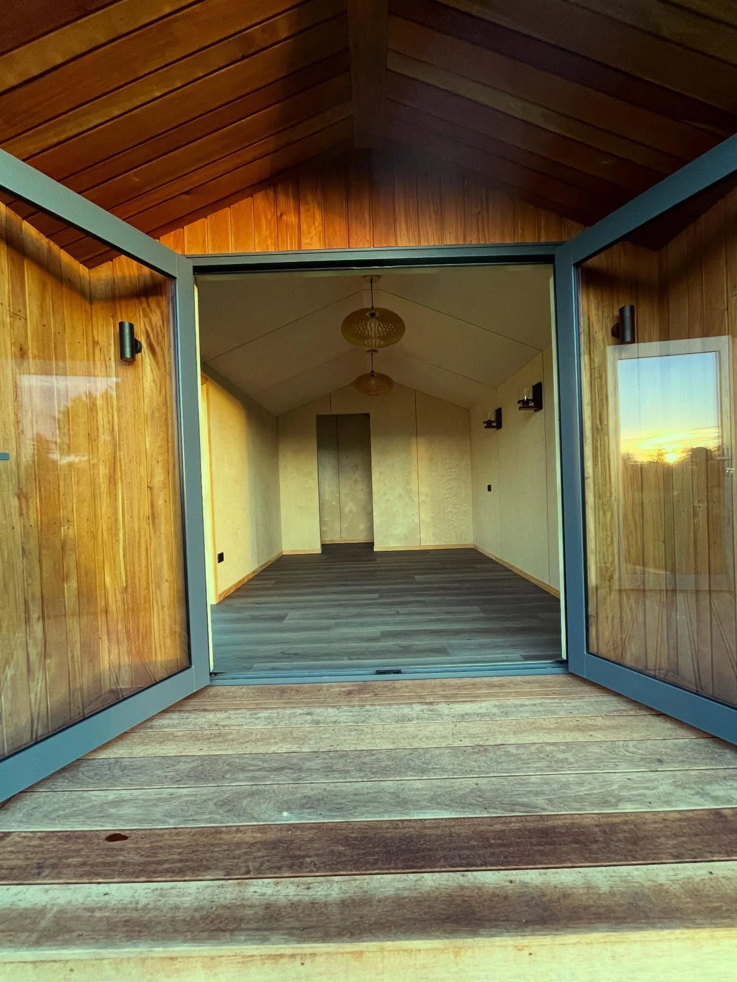 How great does this high-spec cabin built by the RN Building team look 👌

Clad in sleek 5-rib Coloursteel paired with rich timber weatherboards, this build is the perfect cosy cabin. 

Step inside and you&rsquo;re welcomed by feature ply linings wit