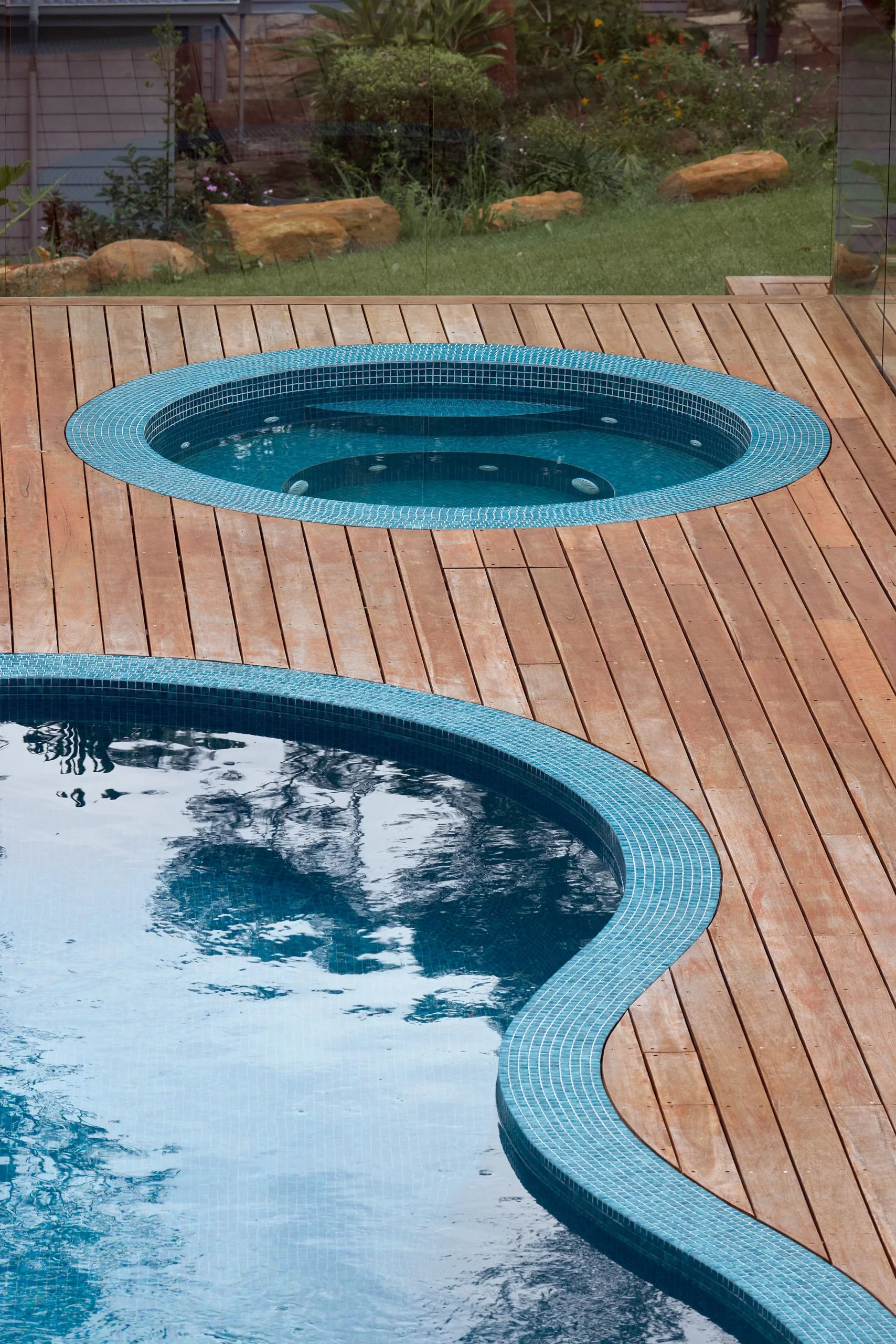 Refreshed pool with mosaic tile coping