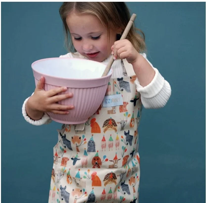 Izzi Rainey. Practical childrens aprons, backpacks and accessories in wondrous designs from Norfolk 