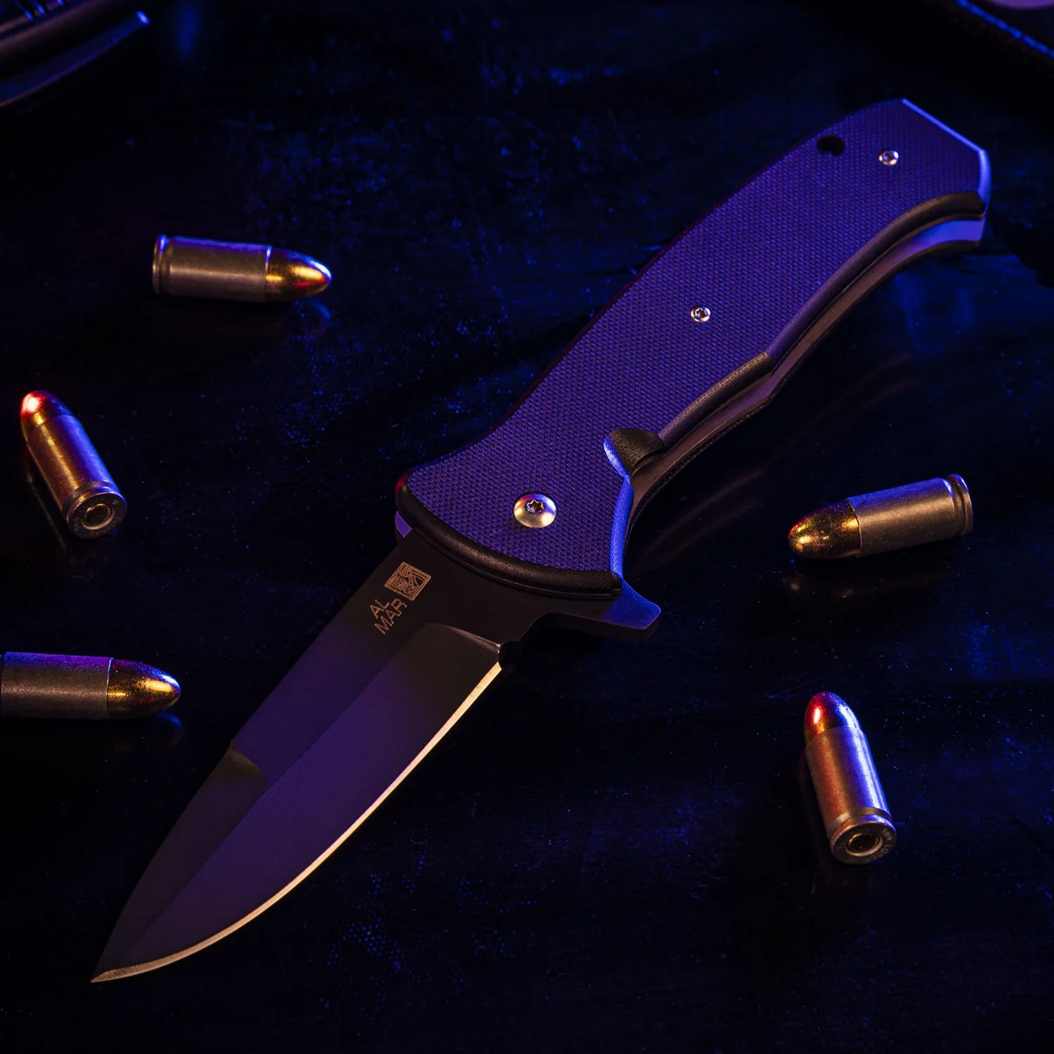 The folding T-Series knife opened and resting near bullets with a blue police light illuminating the space.