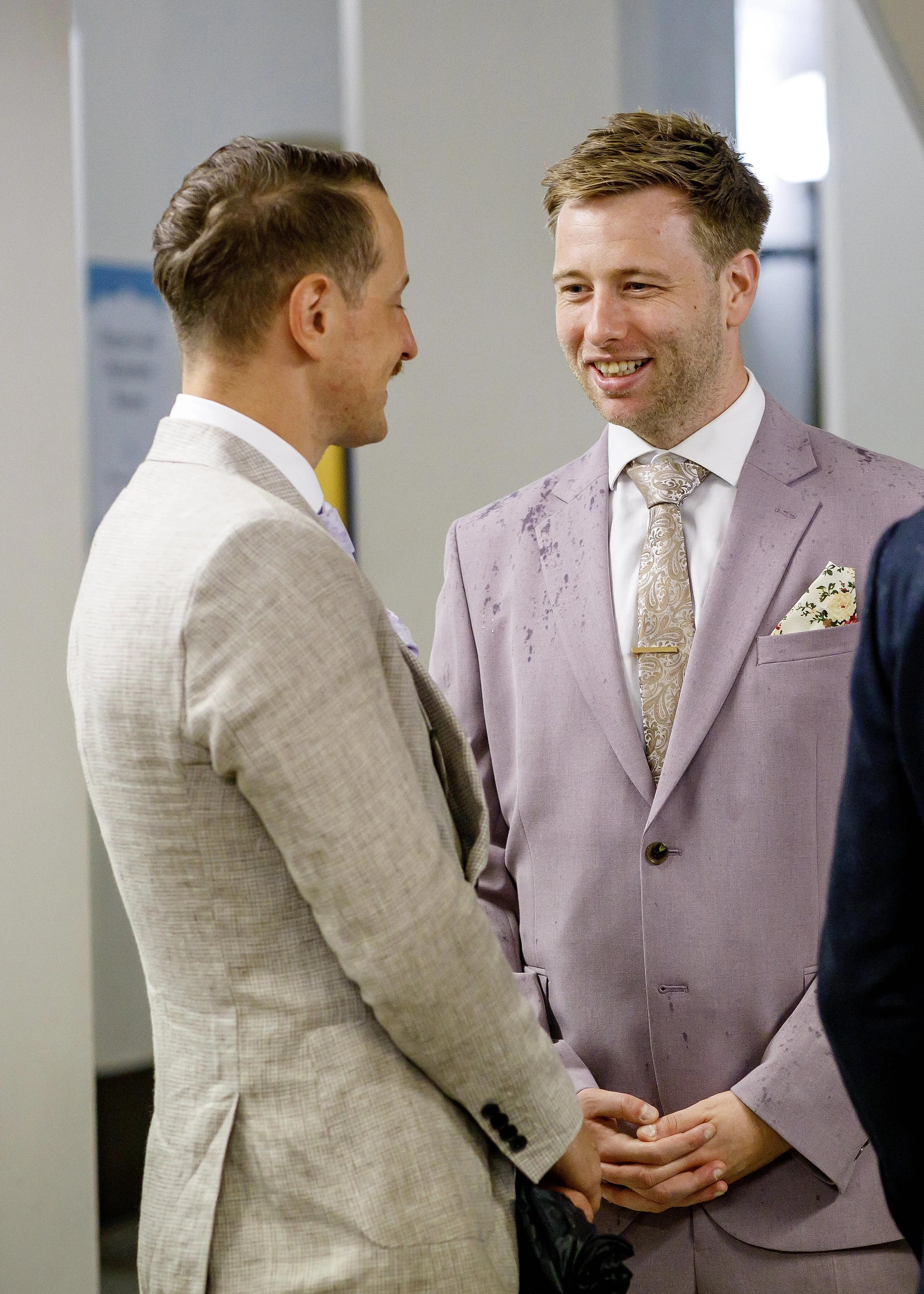 Groom and guests waiting in the historic atrium at Brighton Town Hall