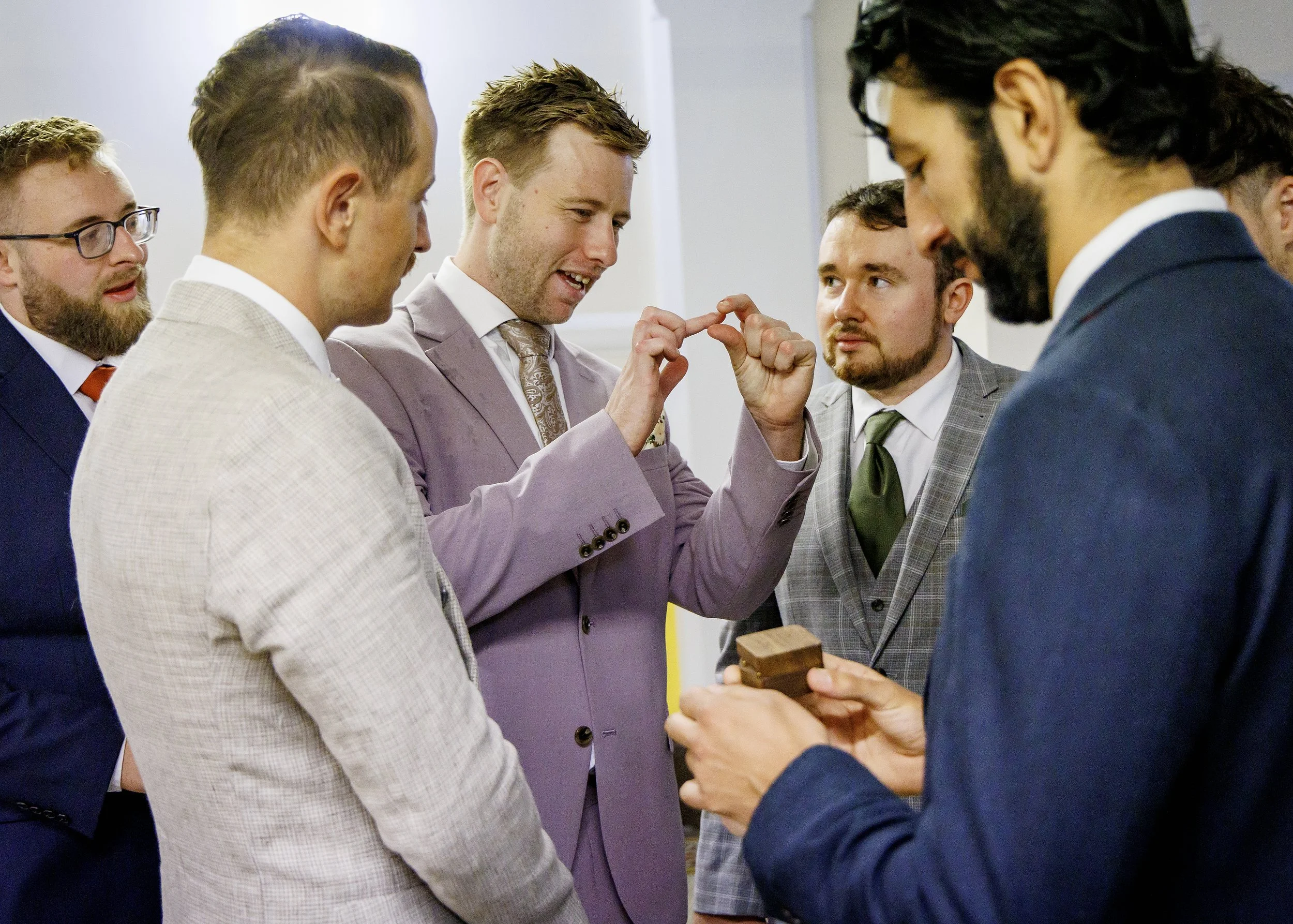 Groom and guests waiting in the historic atrium at Brighton Town Hall