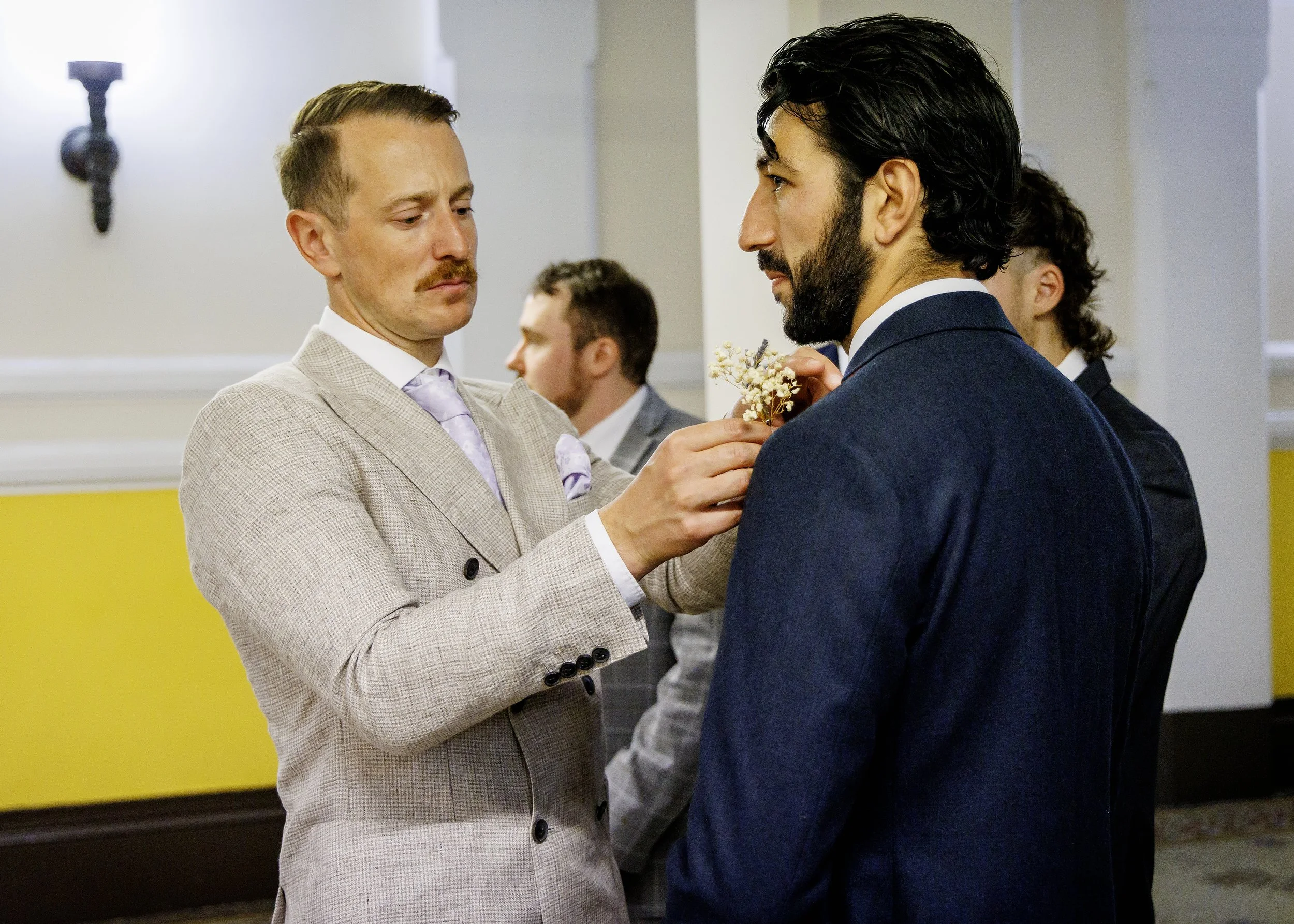 Candid moments before a Regency Room wedding ceremony in Brighton