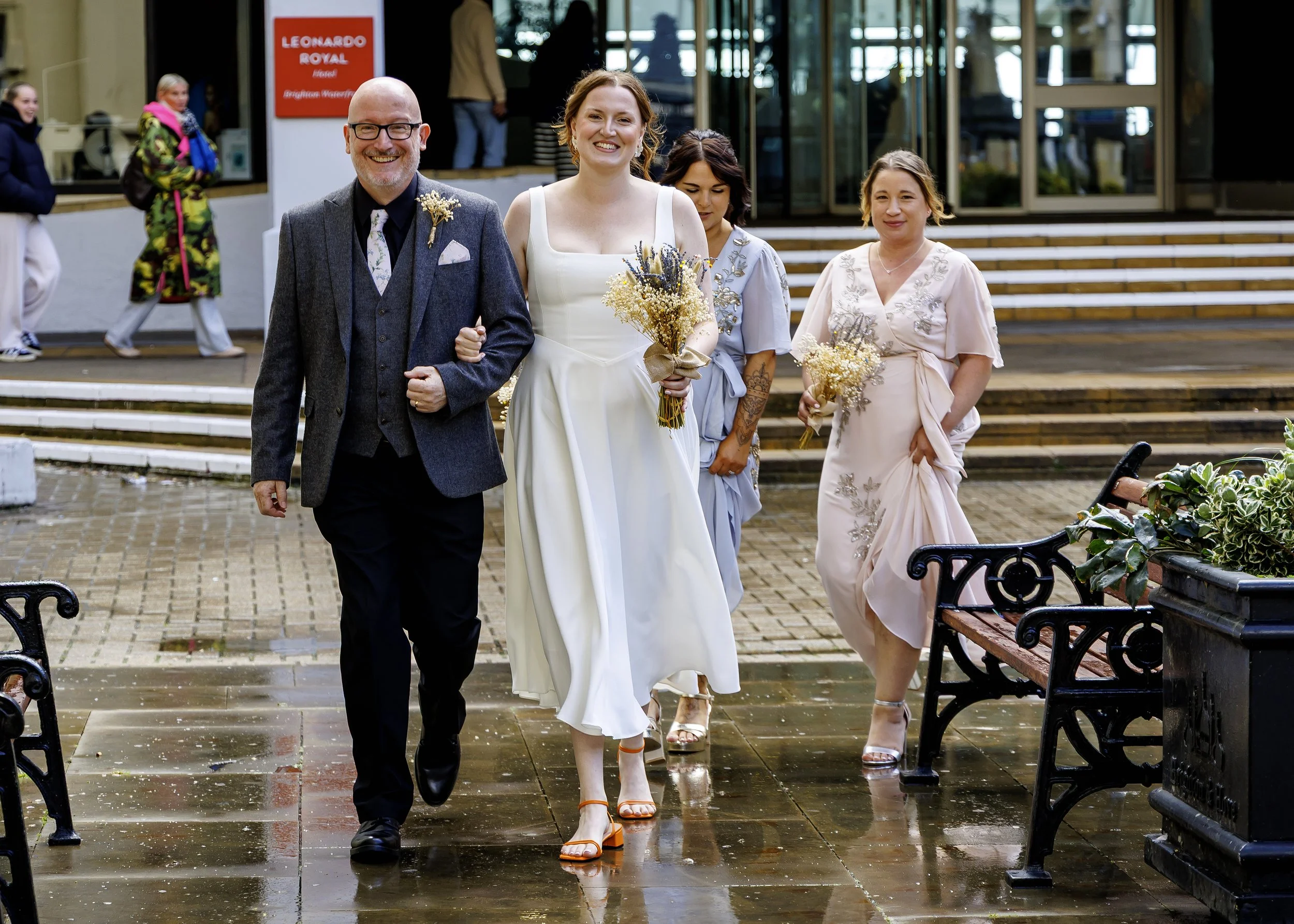 Relaxed documentary photography of the bridal party arriving at Brighton Registry Office