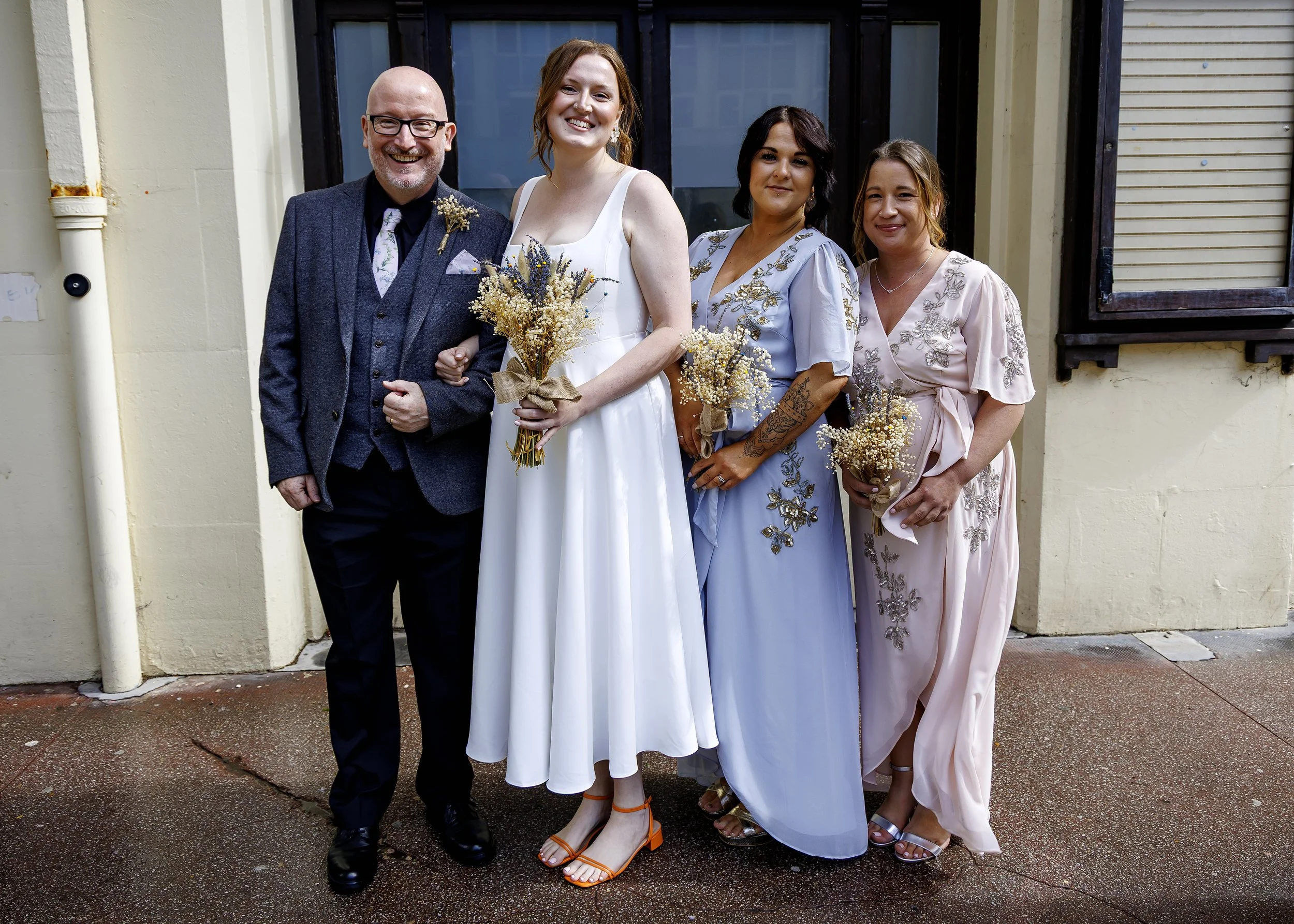 Relaxed documentary photography of the bridal party arriving at Brighton Registry Office