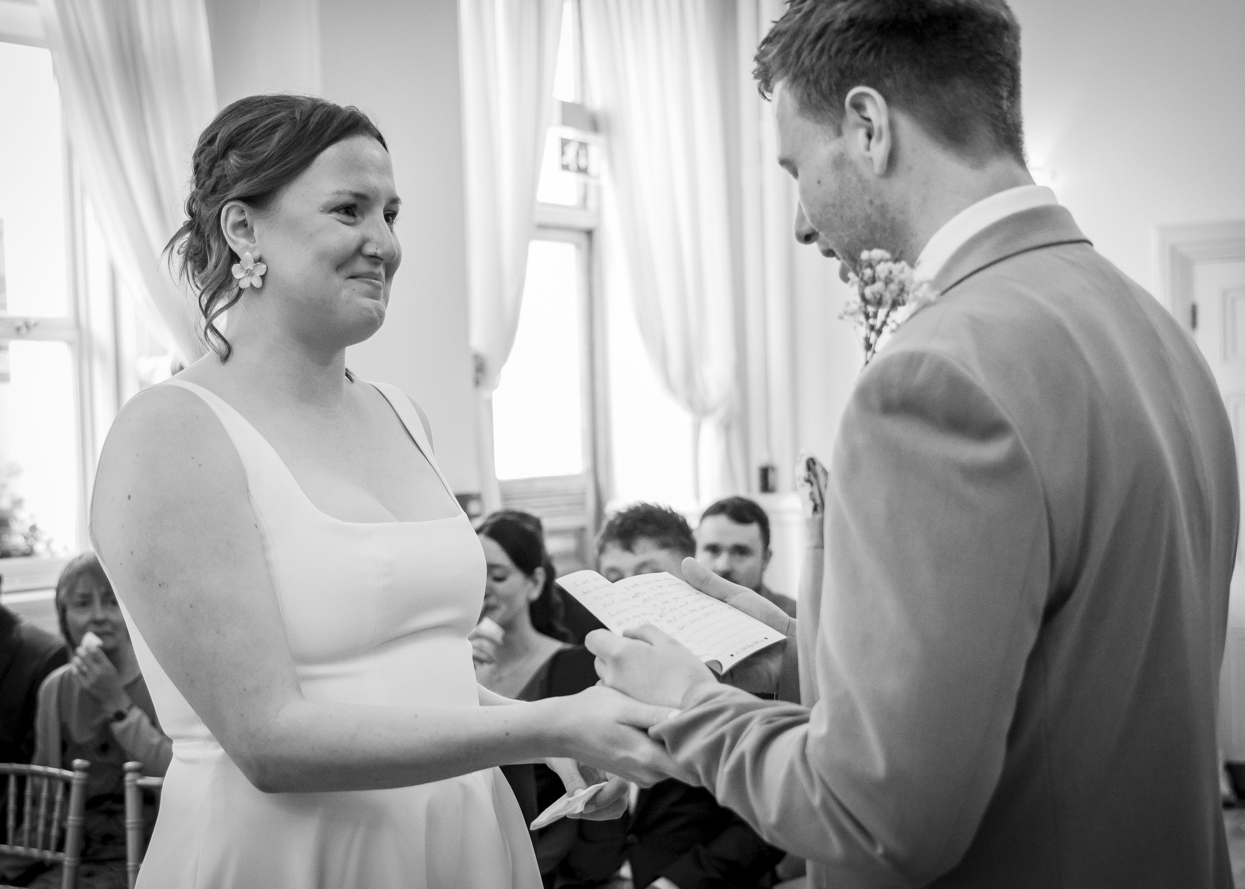 Natural photography of laughter and tears during vow exchange, during a Brighton Regency Suite wedding - Brighton Town Hall, East Sussex Wedding Photographer