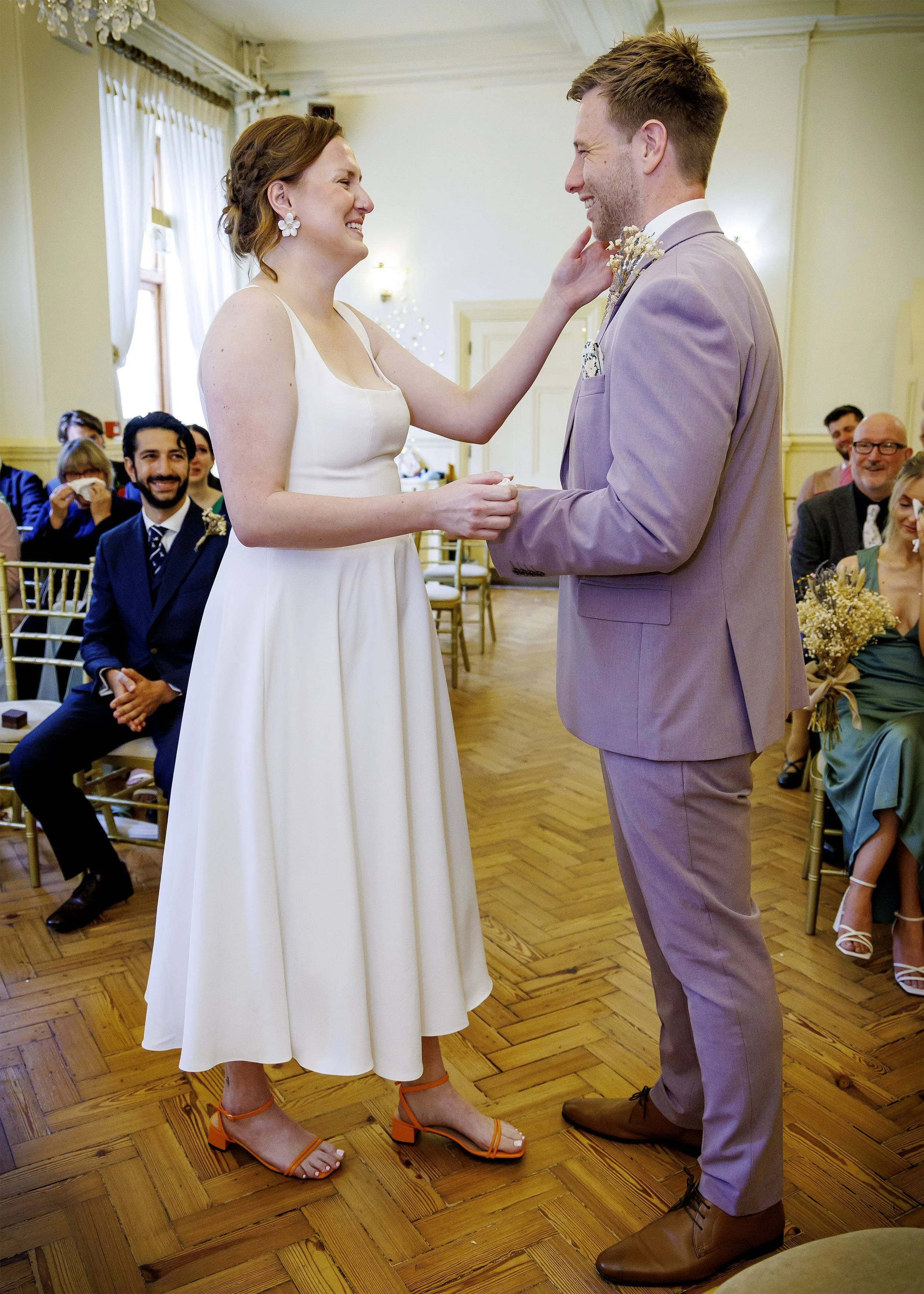 Natural photography of laughter and tears during vow exchange, during a Brighton Regency Suite wedding - Brighton Town Hall, East Sussex Wedding Photographer
