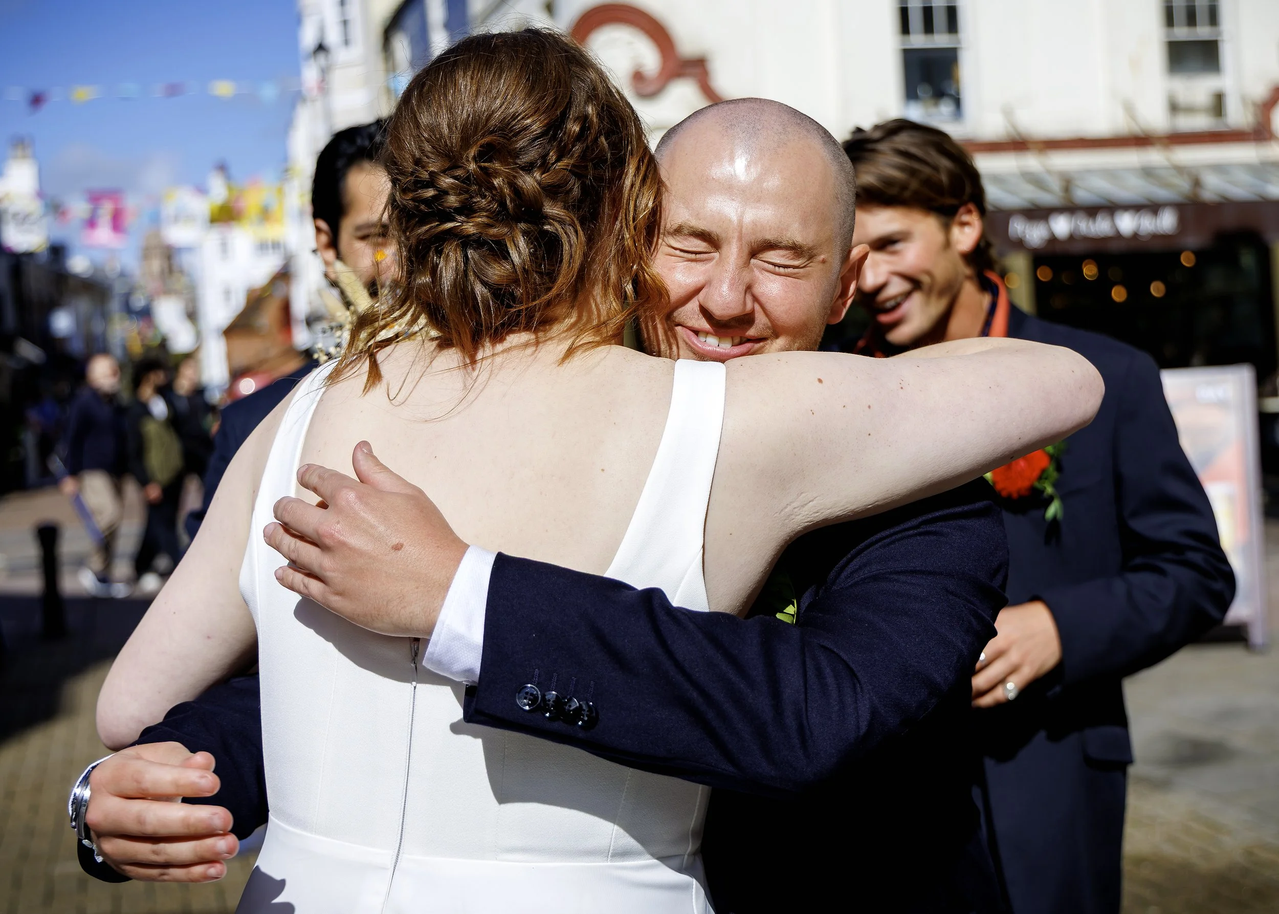 Candid and natural guest photos and mingling outside Brighton Town Hall in the sunshine - East Sussex Wedding Photographer