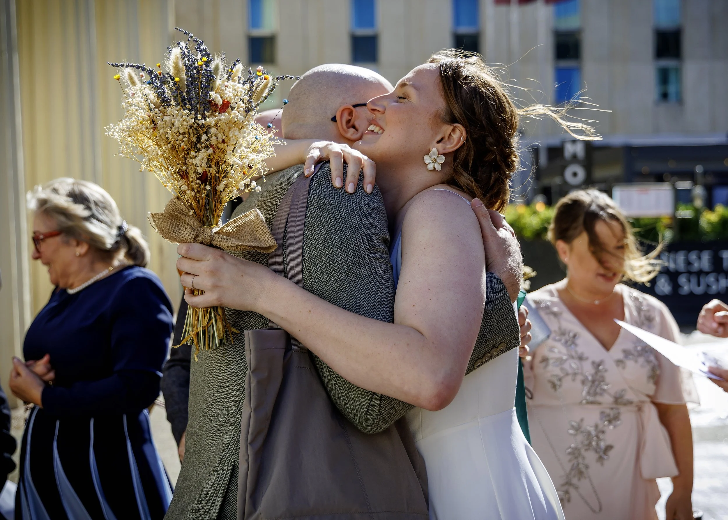 Candid and natural guest photos and mingling outside Brighton Town Hall in the sunshine - East Sussex Wedding Photographer