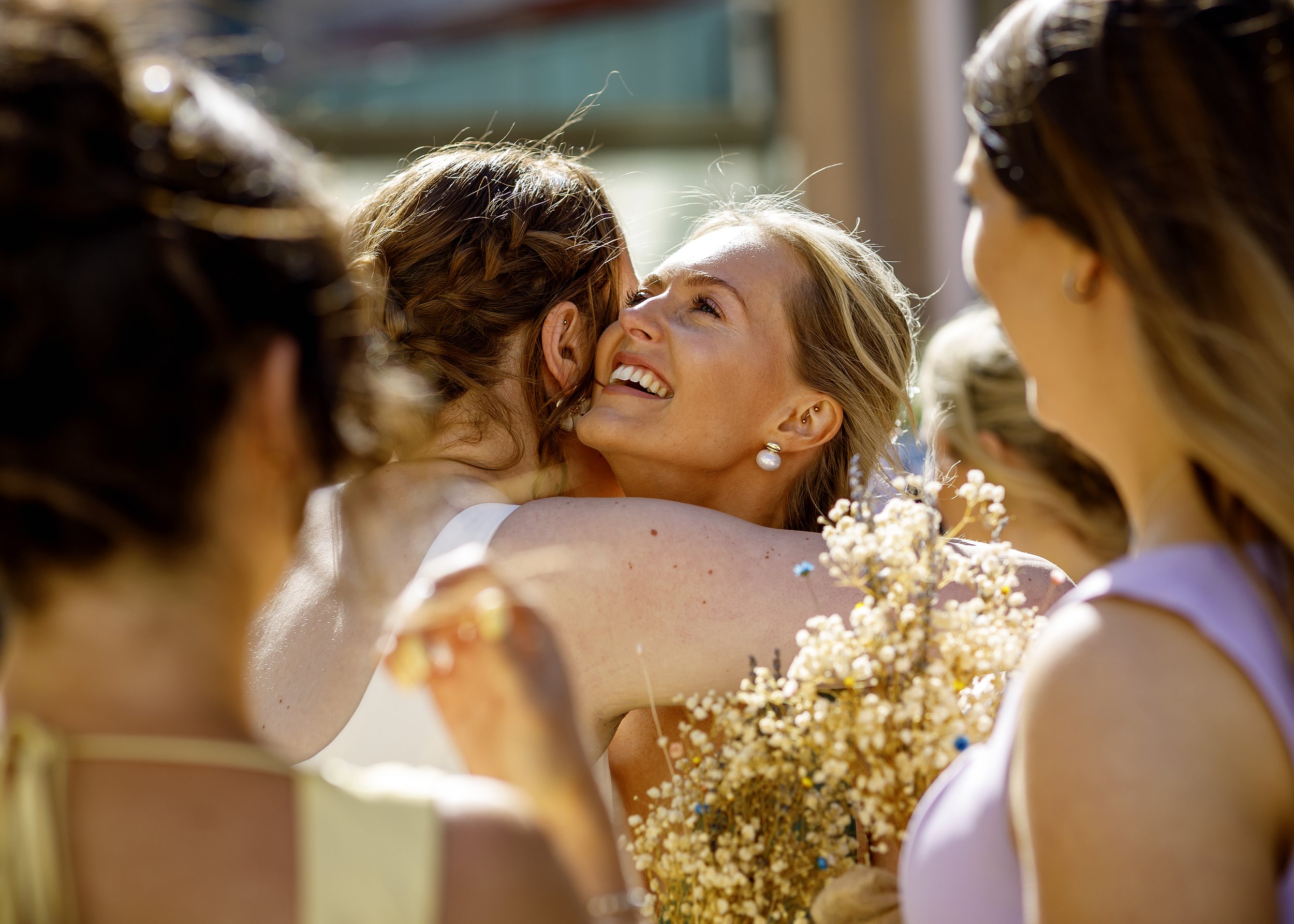Candid and natural guest photos and mingling outside Brighton Town Hall in the sunshine - East Sussex Wedding Photographer