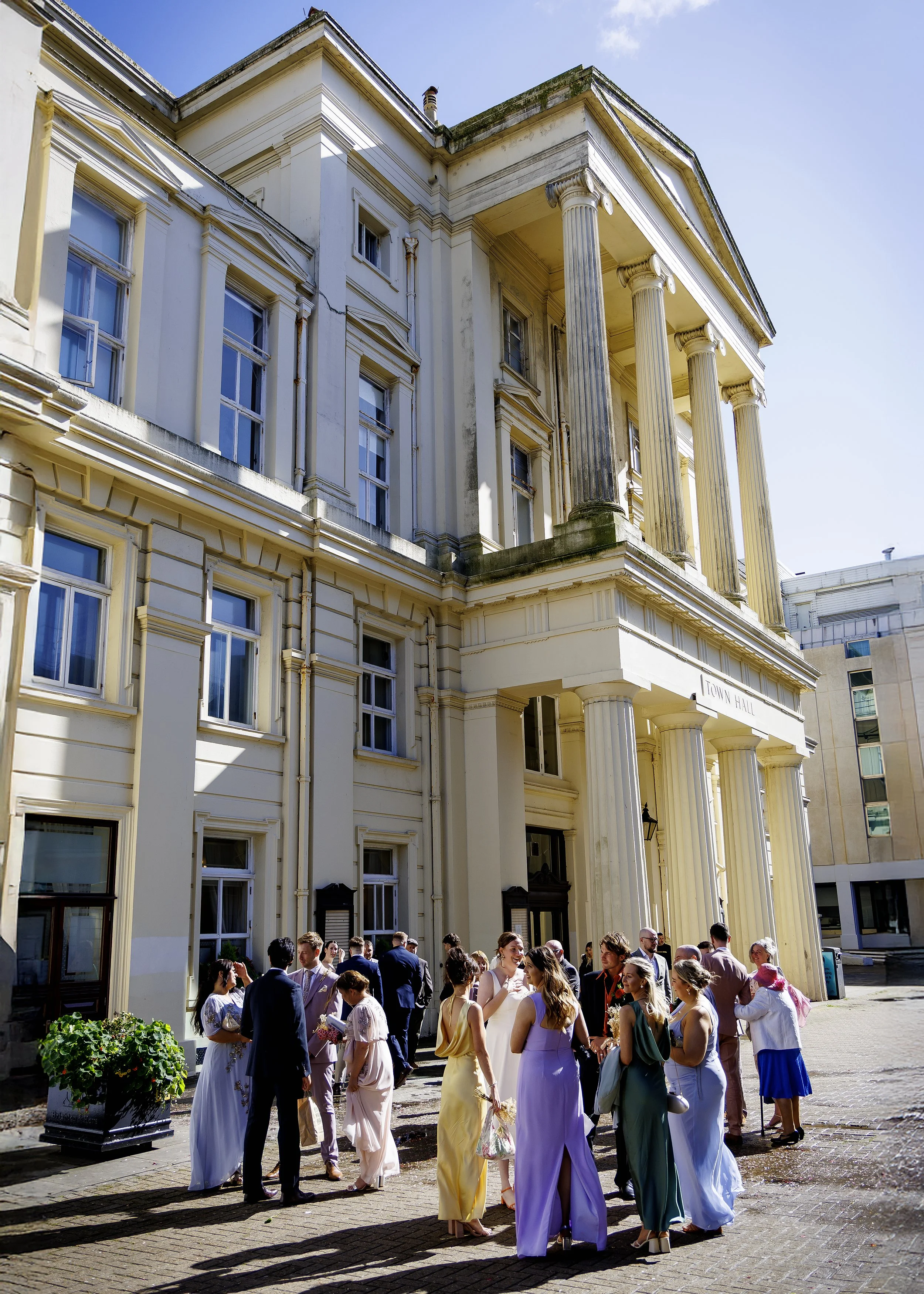 Small wedding celebration outside the historic Brighton Town Hall columns