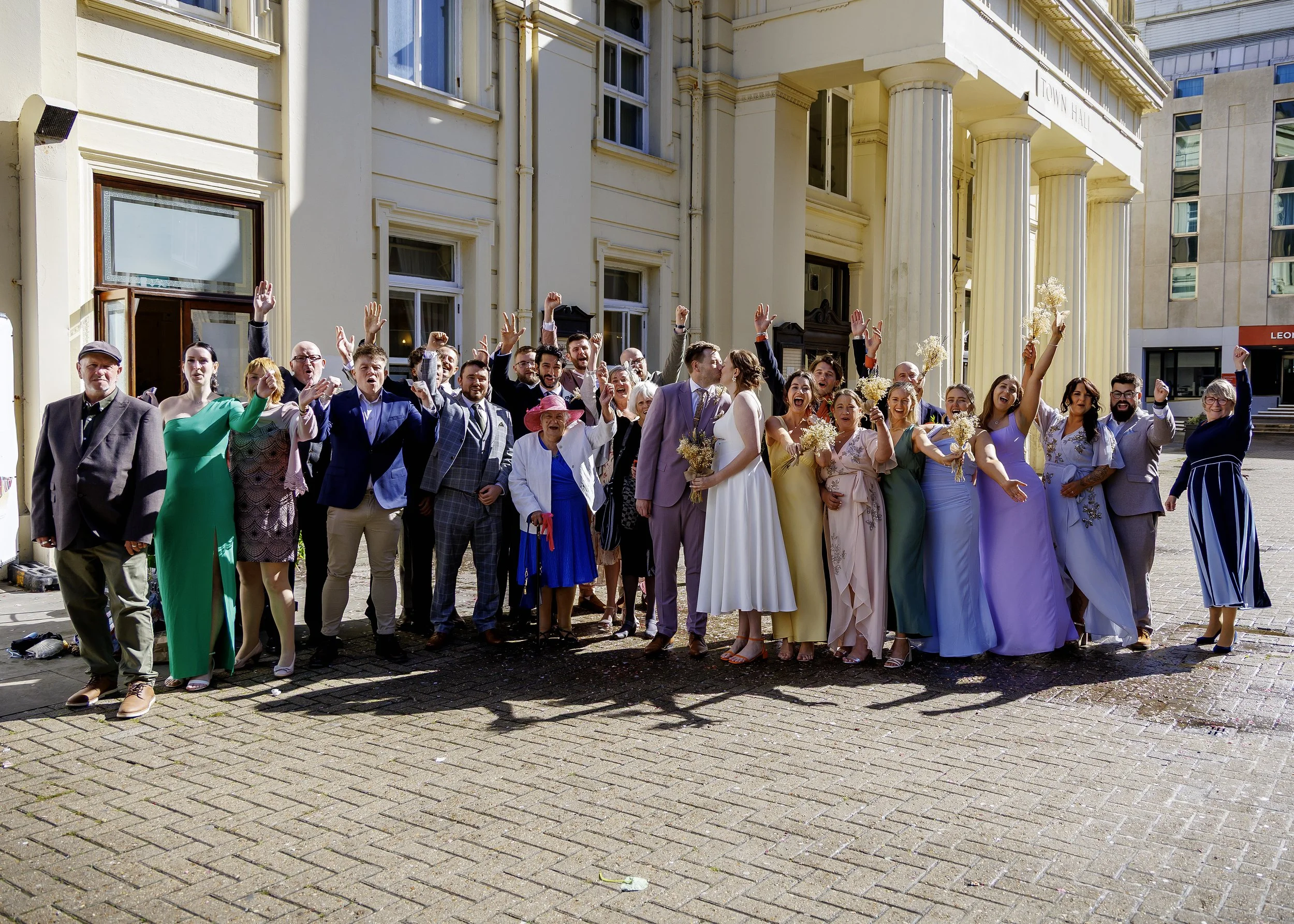 Natural group wedding photography at the entrance of Brighton Registry Office - East Sussex Wedding Photography