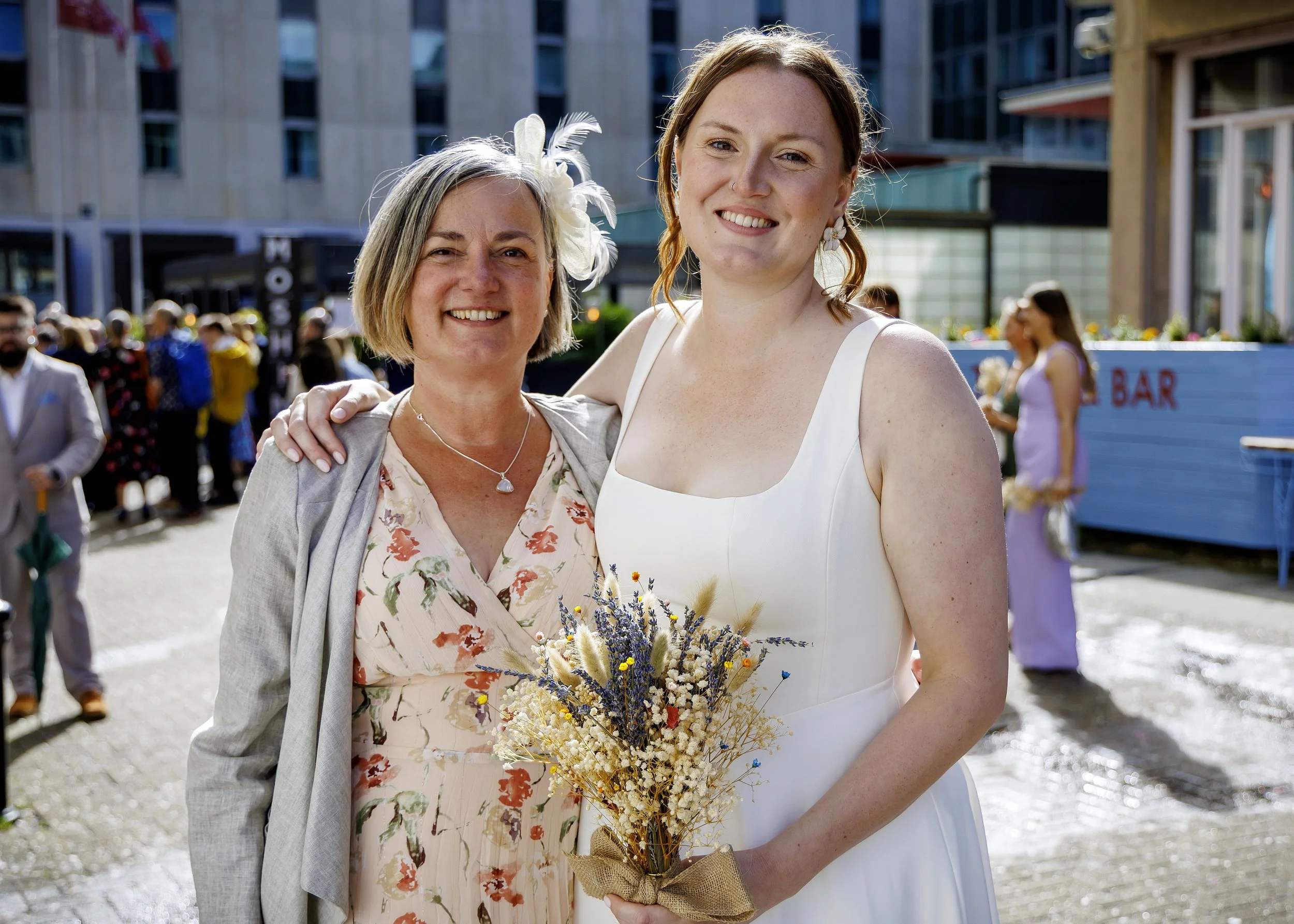 Candid and natural guest photos and mingling outside Brighton Town Hall in the sunshine - East Sussex Wedding Photographer