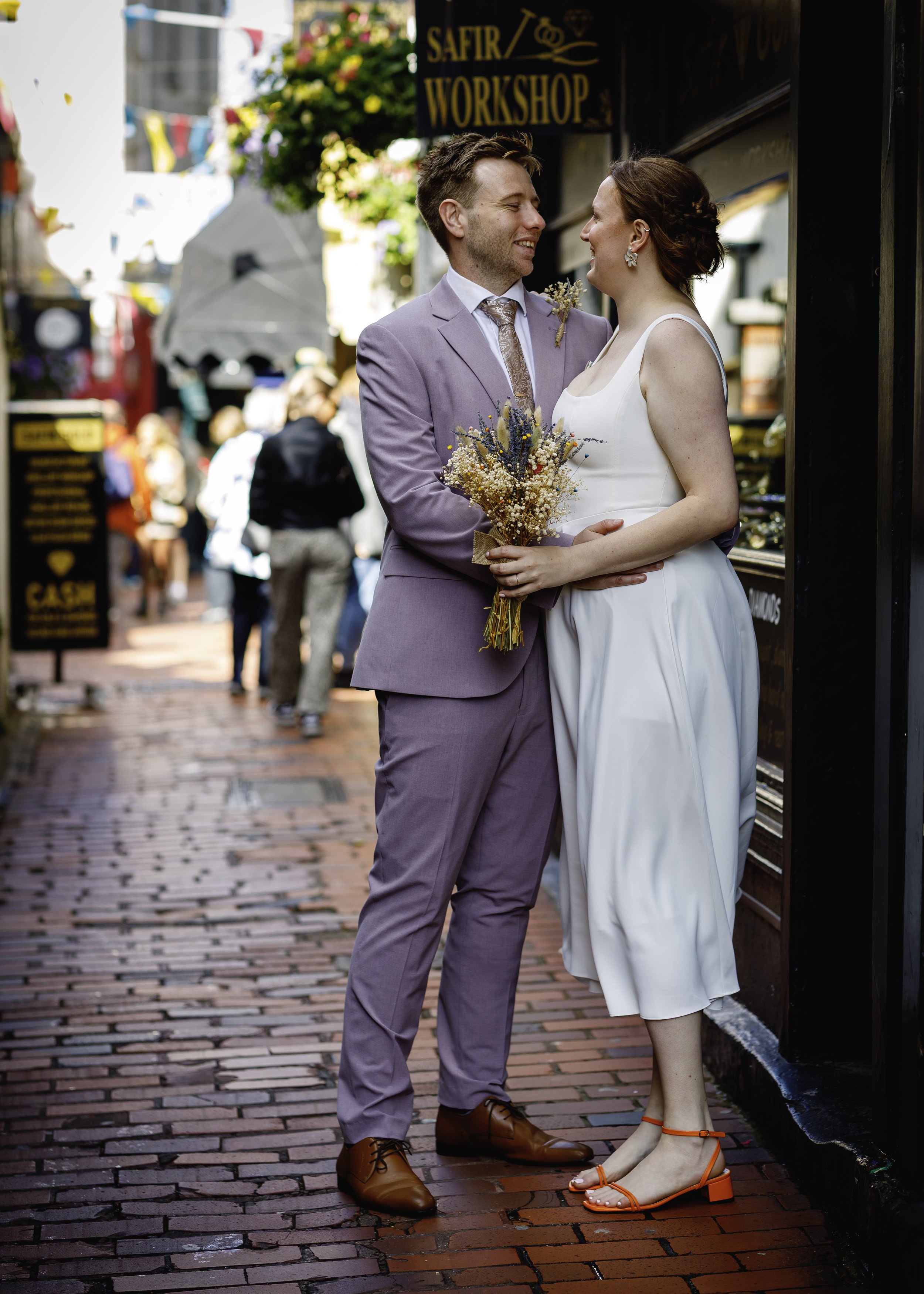 Relaxed couple portraits in the colourful Brighton Lanes after the ceremony - East Sussex Wedding Photography