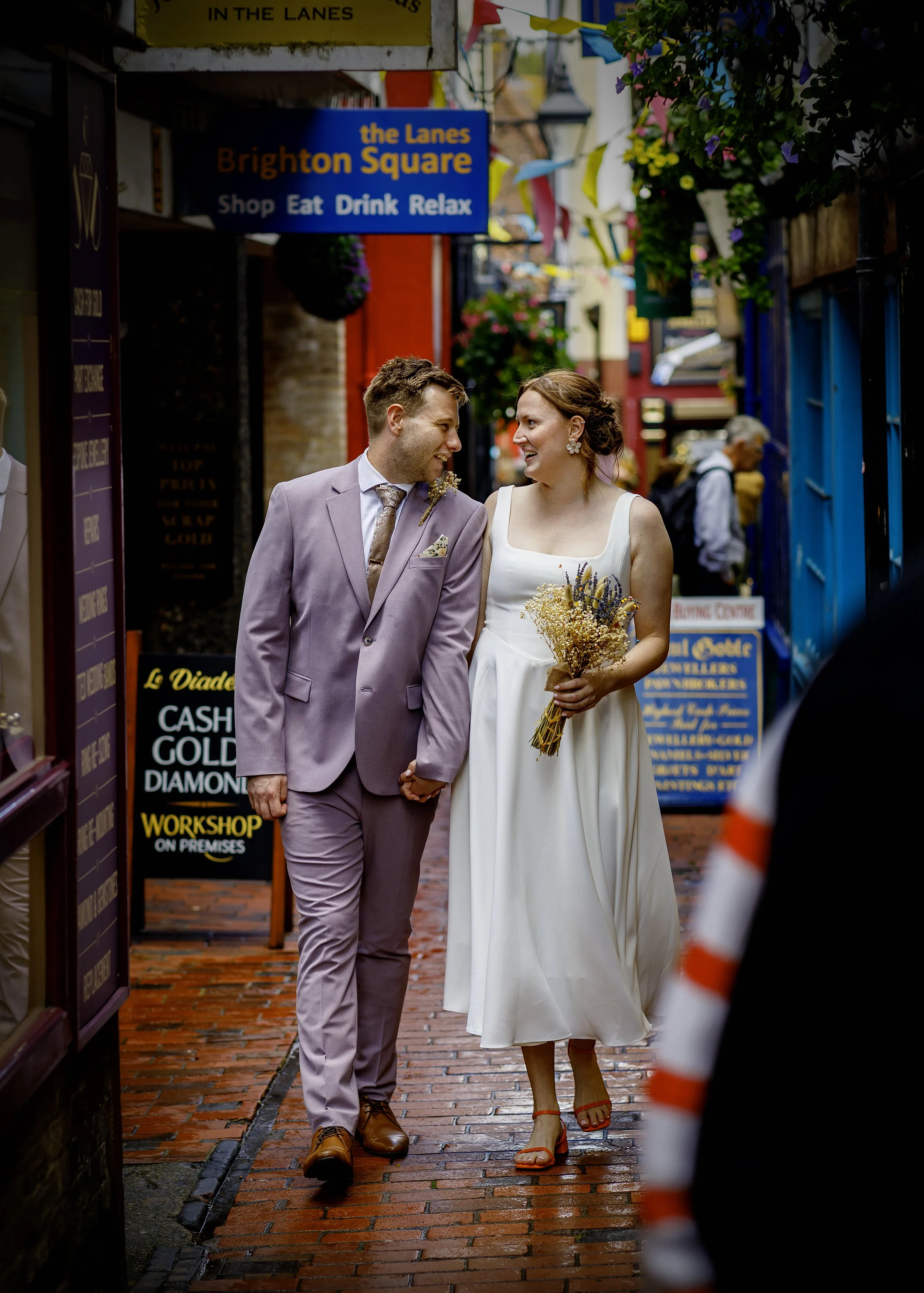 Relaxed couple portraits in the colourful Brighton Lanes after the ceremony - East Sussex Wedding Photography