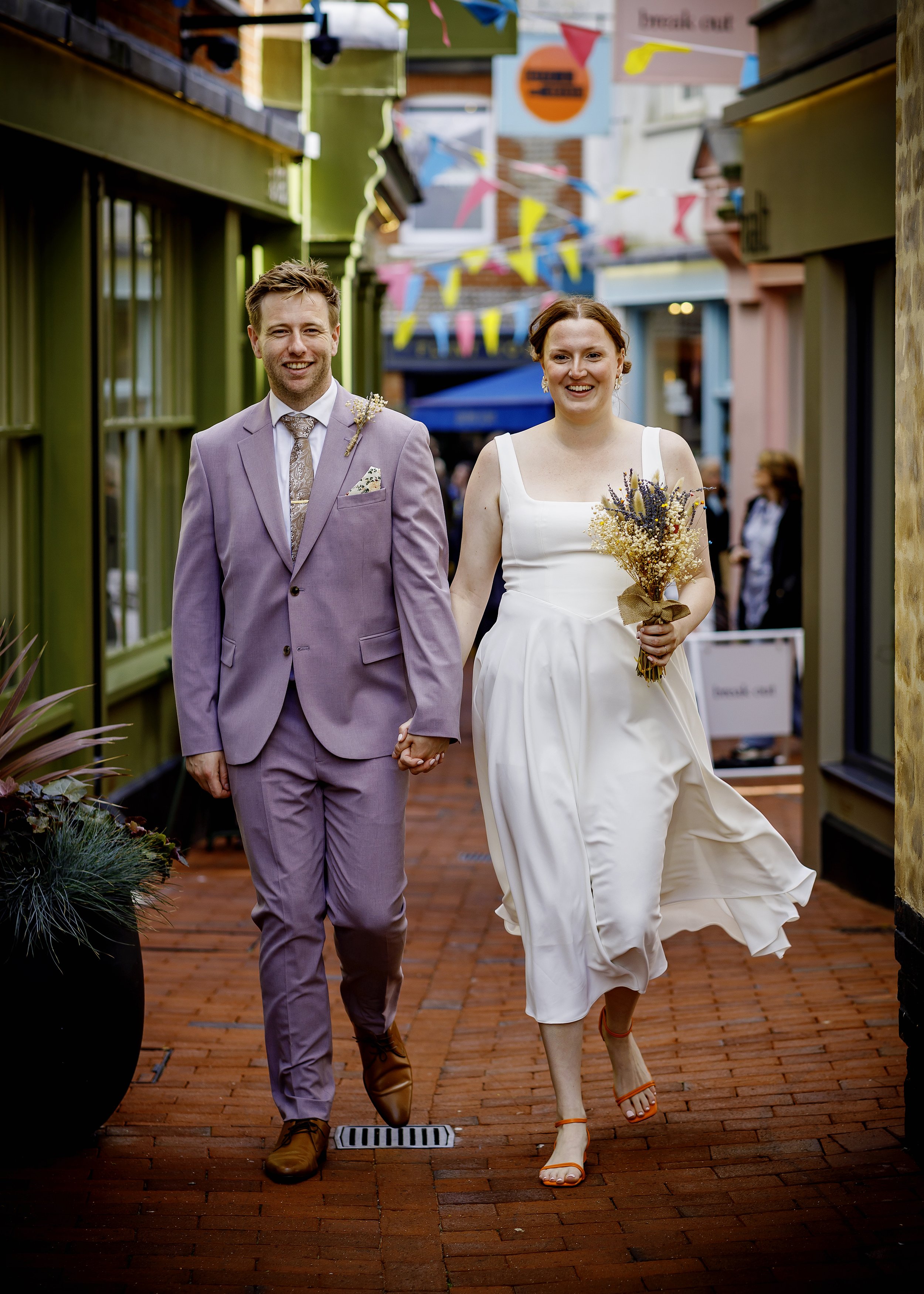 Relaxed couple portraits in the colourful Brighton Lanes after the ceremony - East Sussex Wedding Photographer