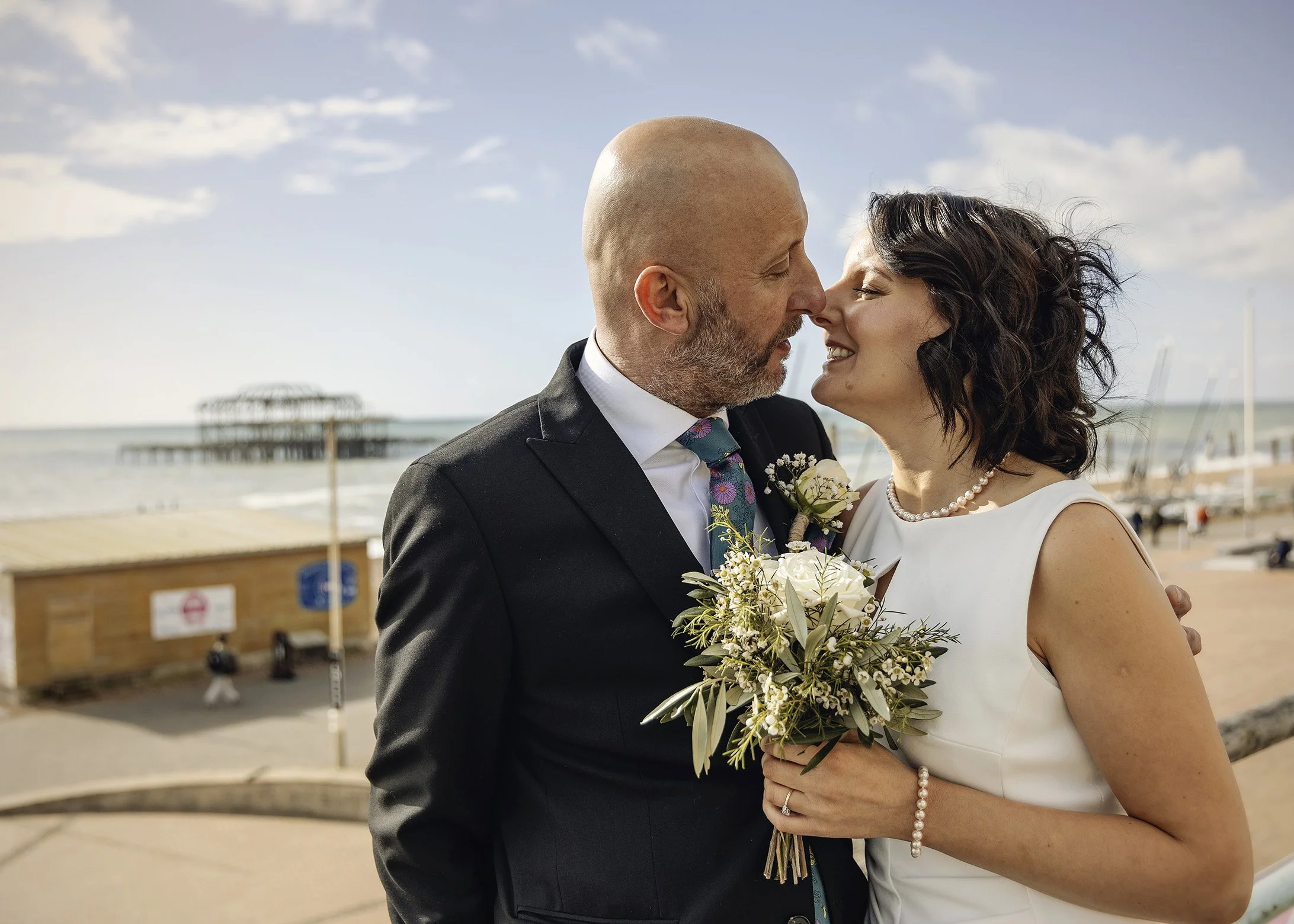 Candid relaxed and natural elopement photography on Brighton beach - East Sussex weddings