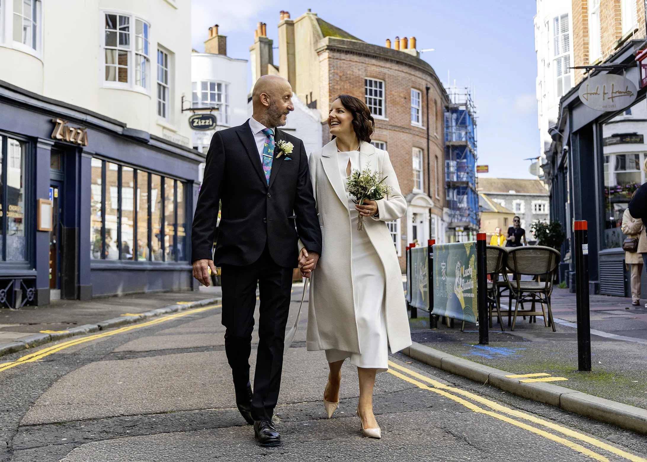 Natural couple photoshoot along the Brighton promenade after a Town Hall ceremony
